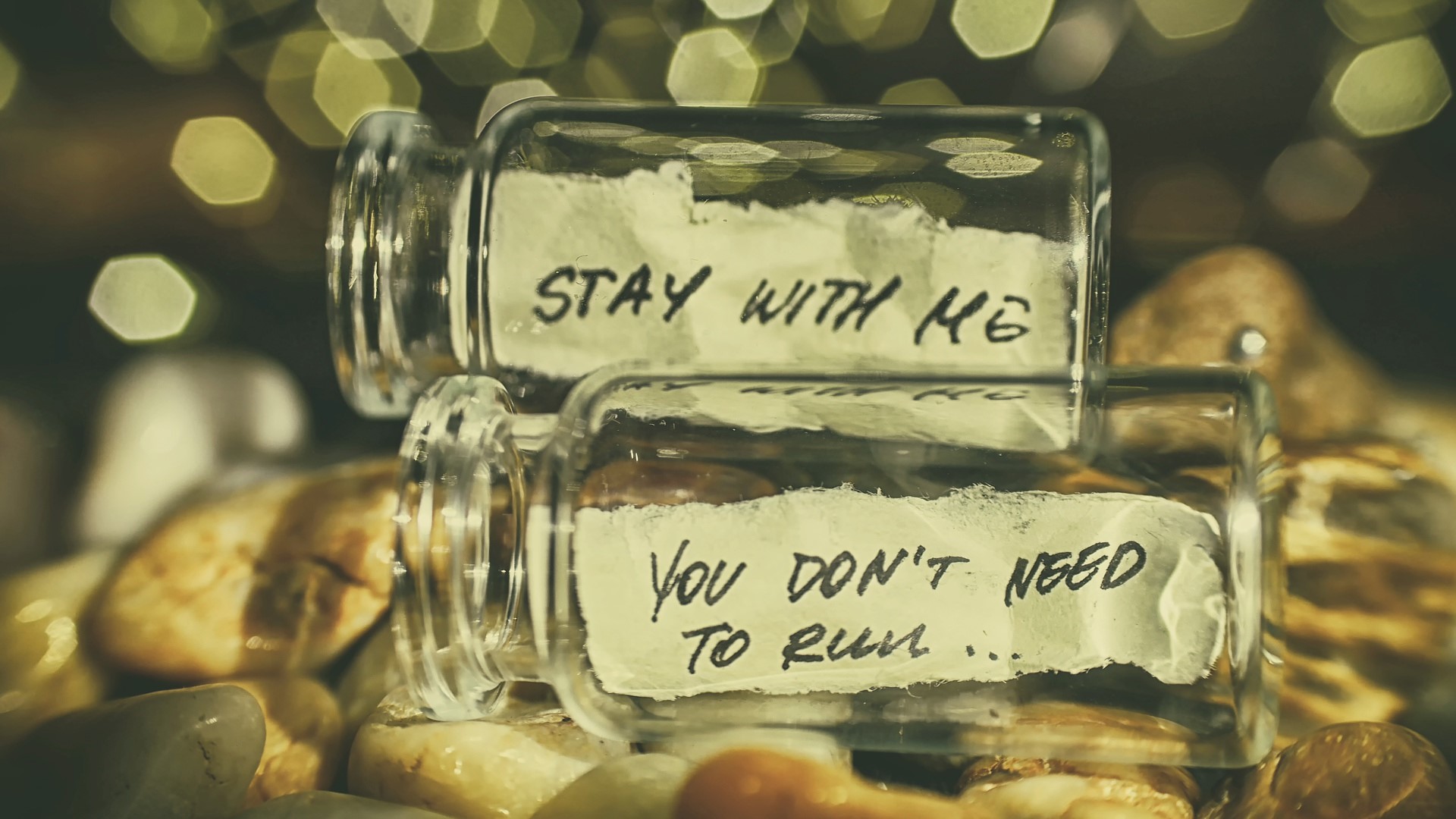 Two glass jars with handwritten notes on stones HD Wallpaper