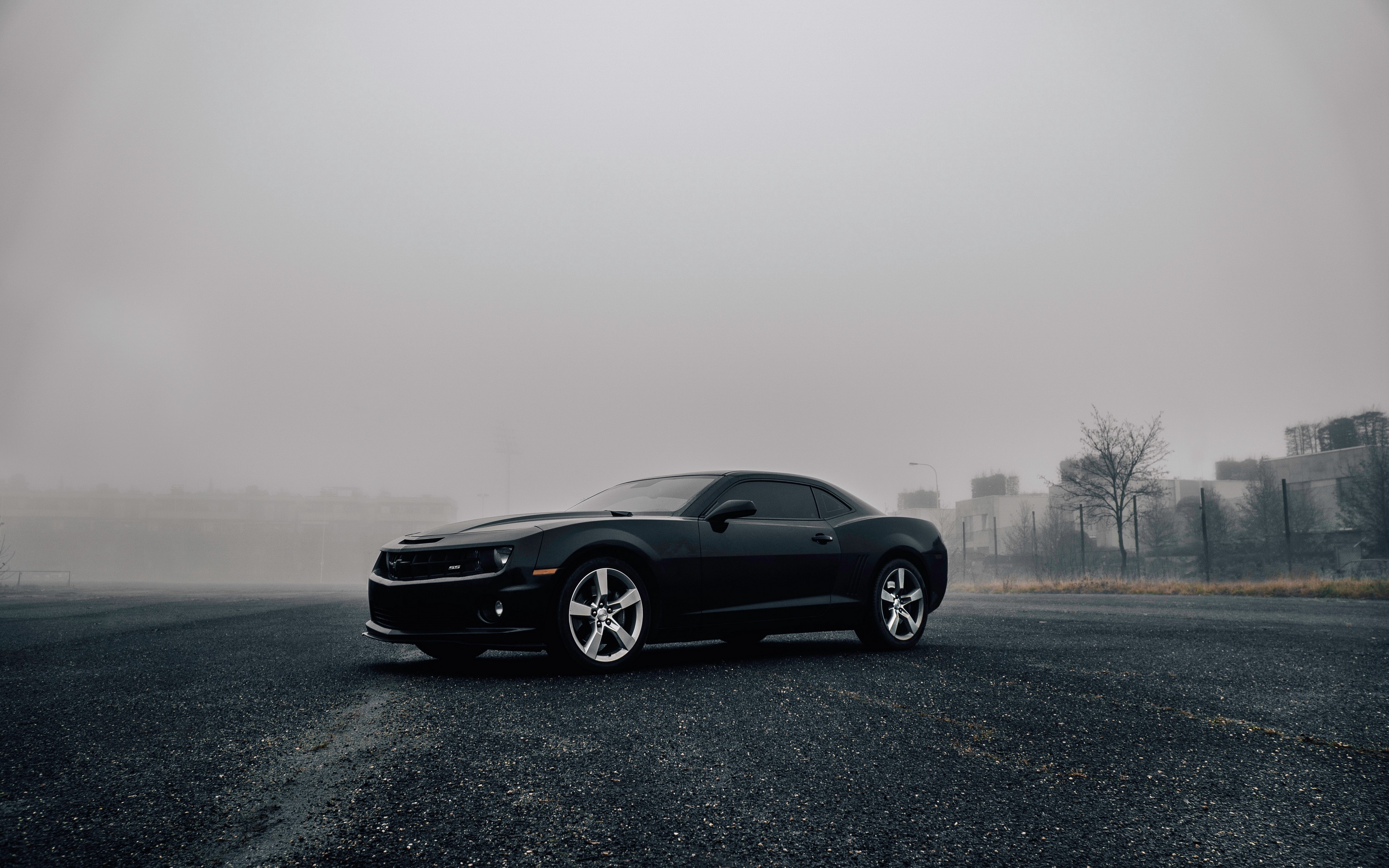 Black Chevrolet Camaro on asphalt in mist HD Wallpaper