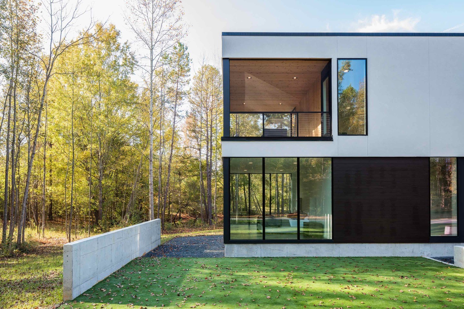 Modern house with large windows and trees HD Wallpaper
