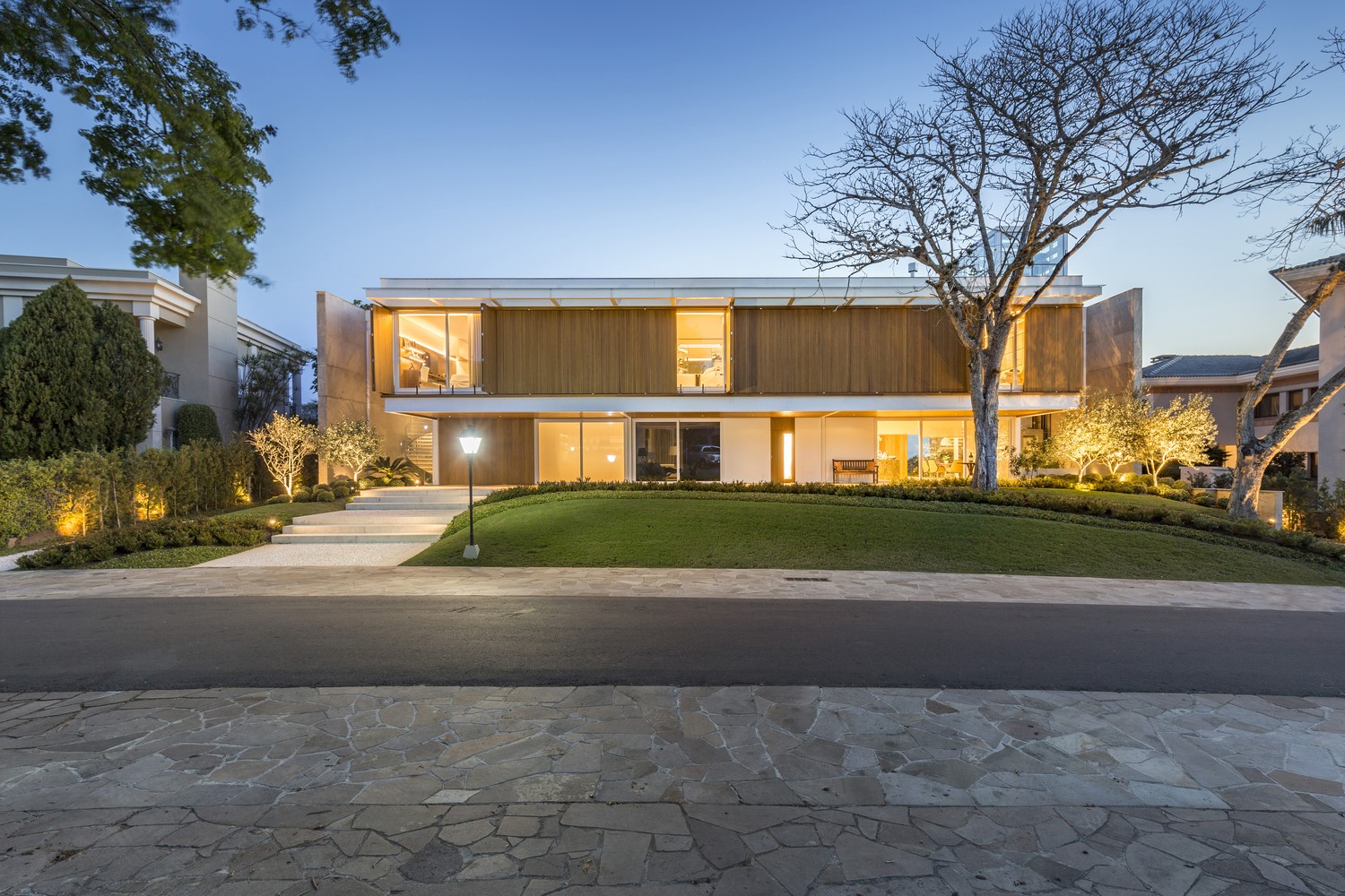 Modern house with wooden facade and large windows HD Wallpaper