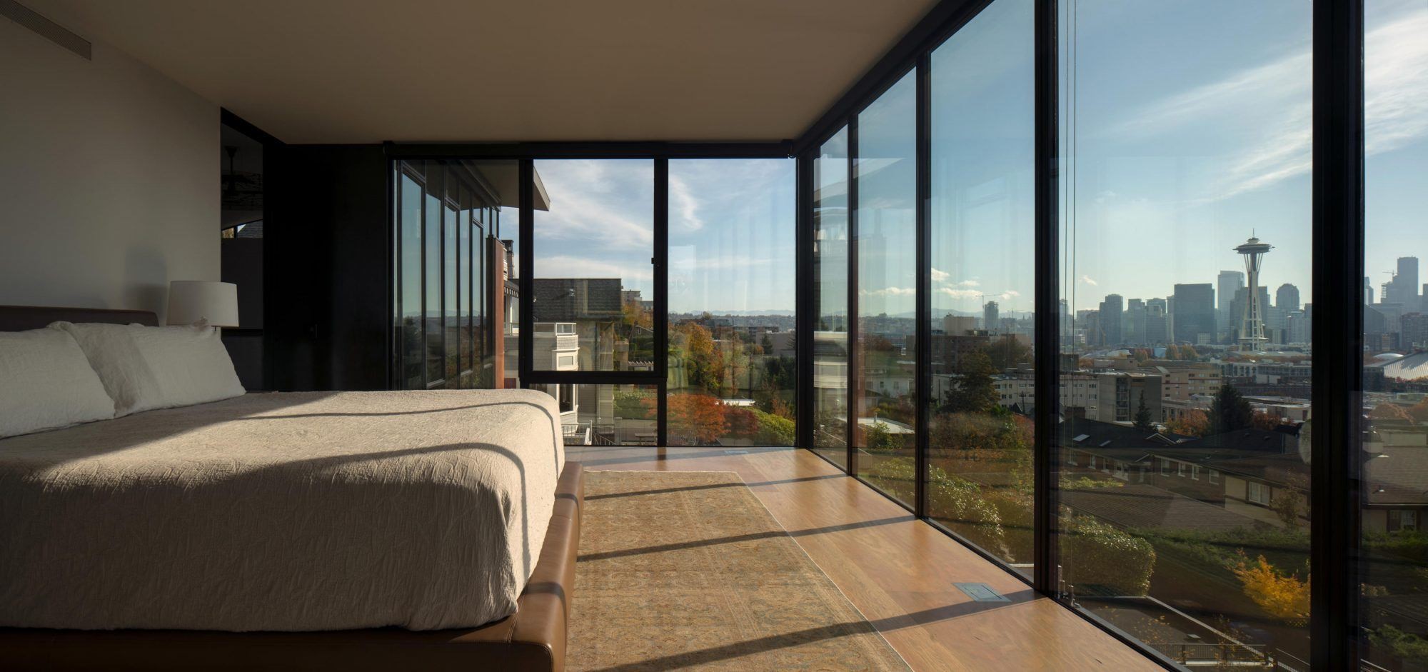 Modern bedroom with Seattle skyline view HD Wallpaper