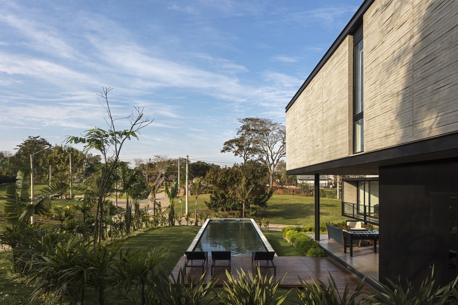 Modern concrete house with swimming pool and garden HD Wallpaper