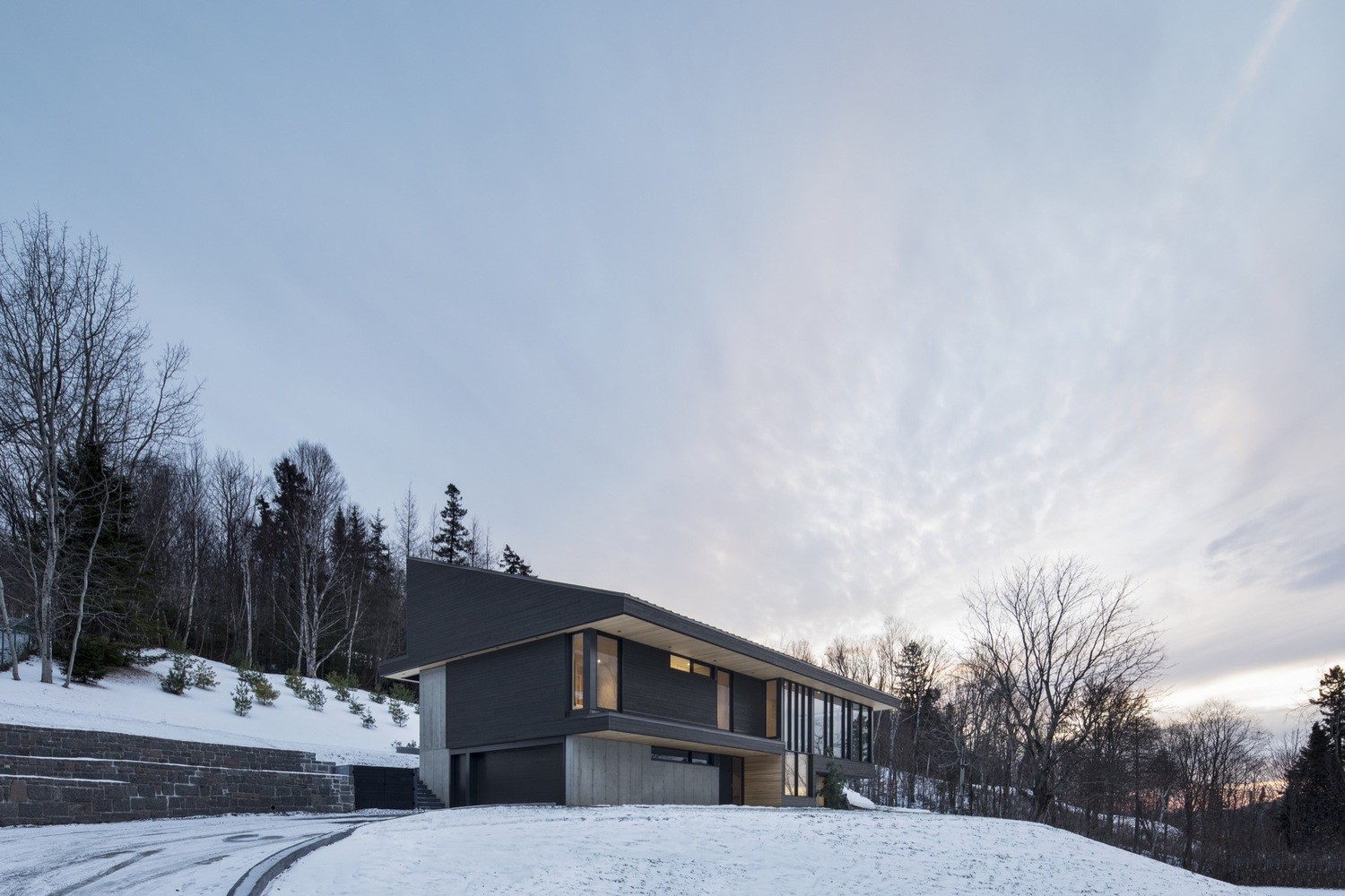Modern house in snow with trees HD Wallpaper