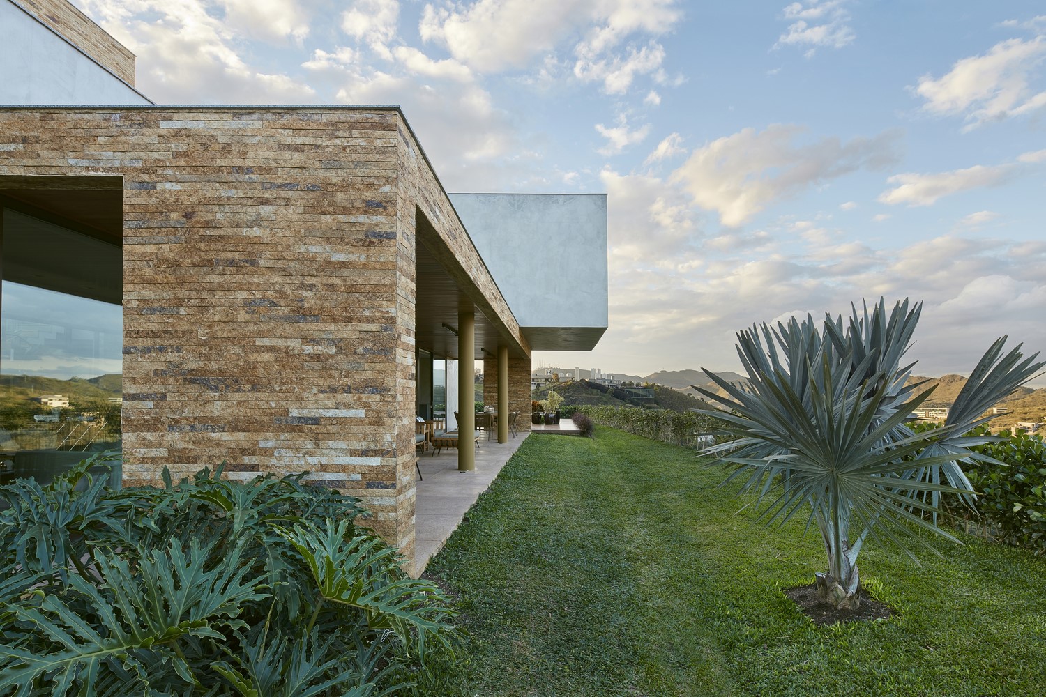 Modern house with stone facade and garden HD Wallpaper