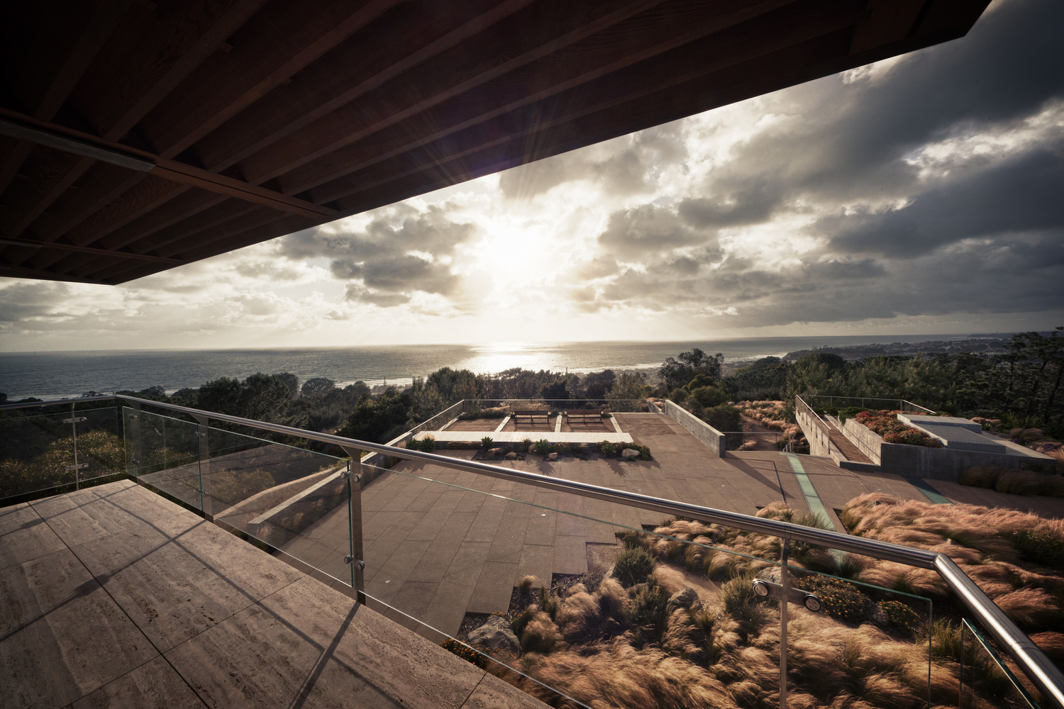 Modern balcony overlooking the ocean at sunset HD Wallpaper
