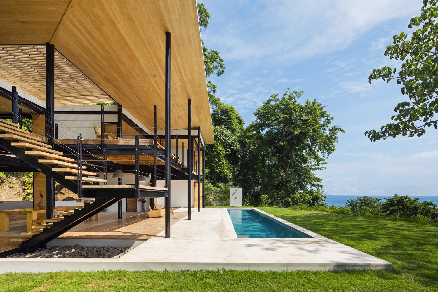 Modern house with swimming pool and ocean view HD Wallpaper