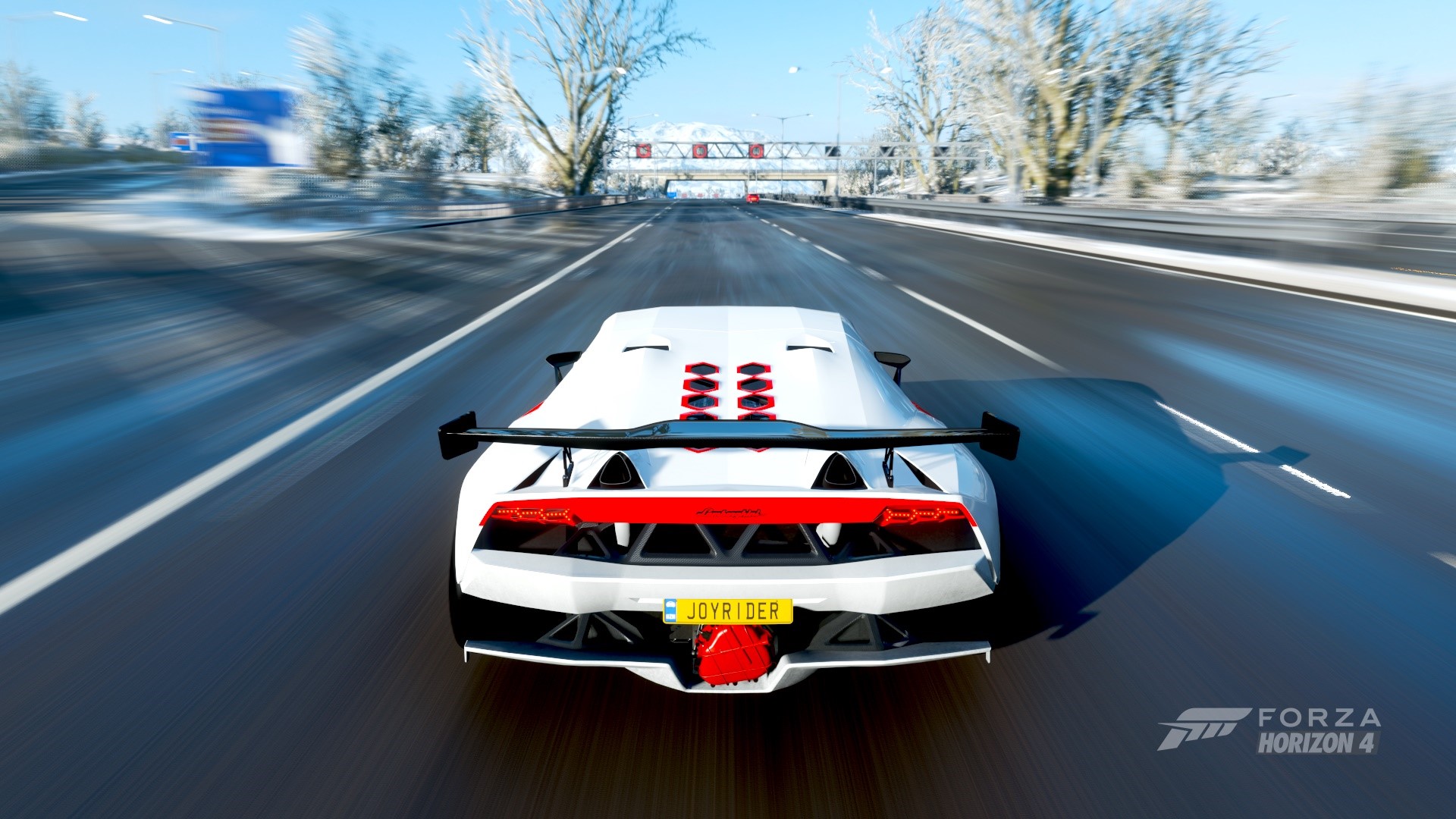White sports car driving on a snowy road in Forza Horizon 4 HD Wallpaper