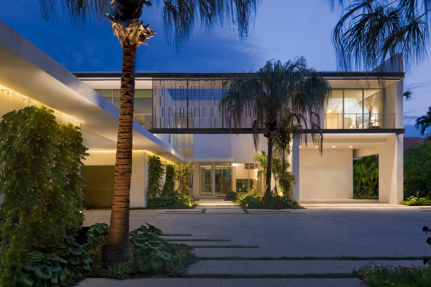 Modern mansion with palm trees at dusk HD Wallpaper