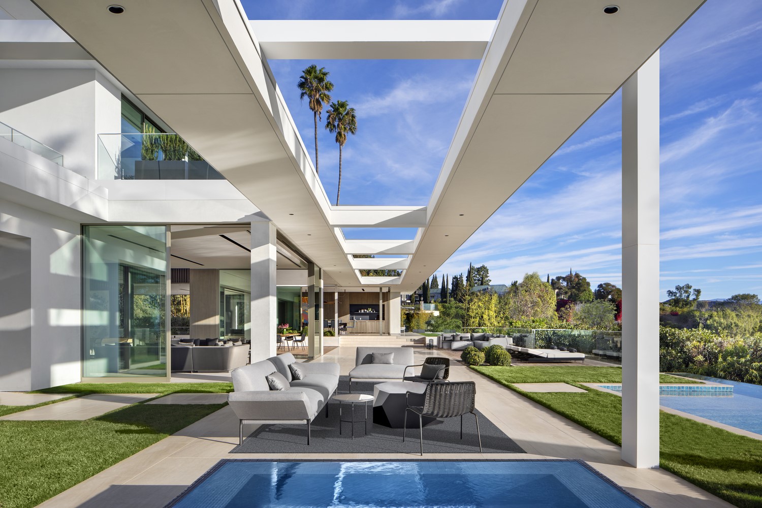 Modern house with outdoor living space and pool HD Wallpaper