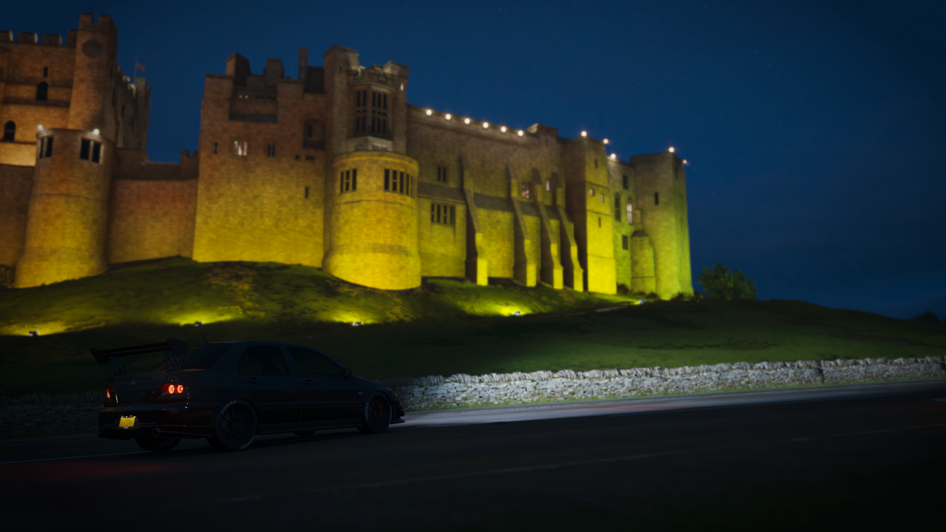 Mitsubishi Lancer EVO in front of a castle at night HD Wallpaper