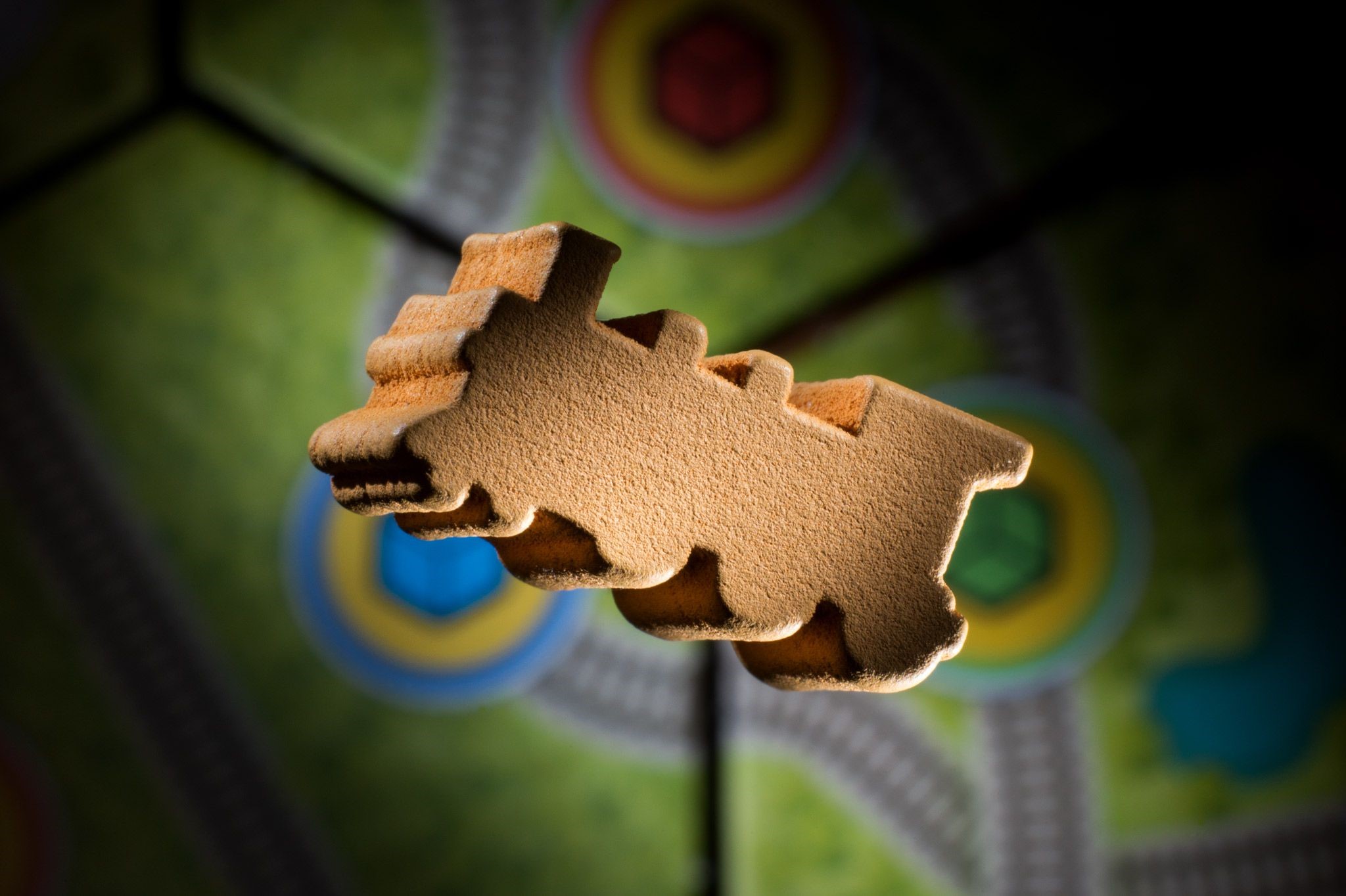 Wooden train token on a board game HD Wallpaper