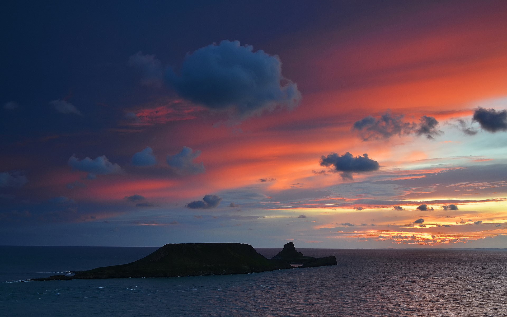 Island in the sea during sunset HD Wallpaper