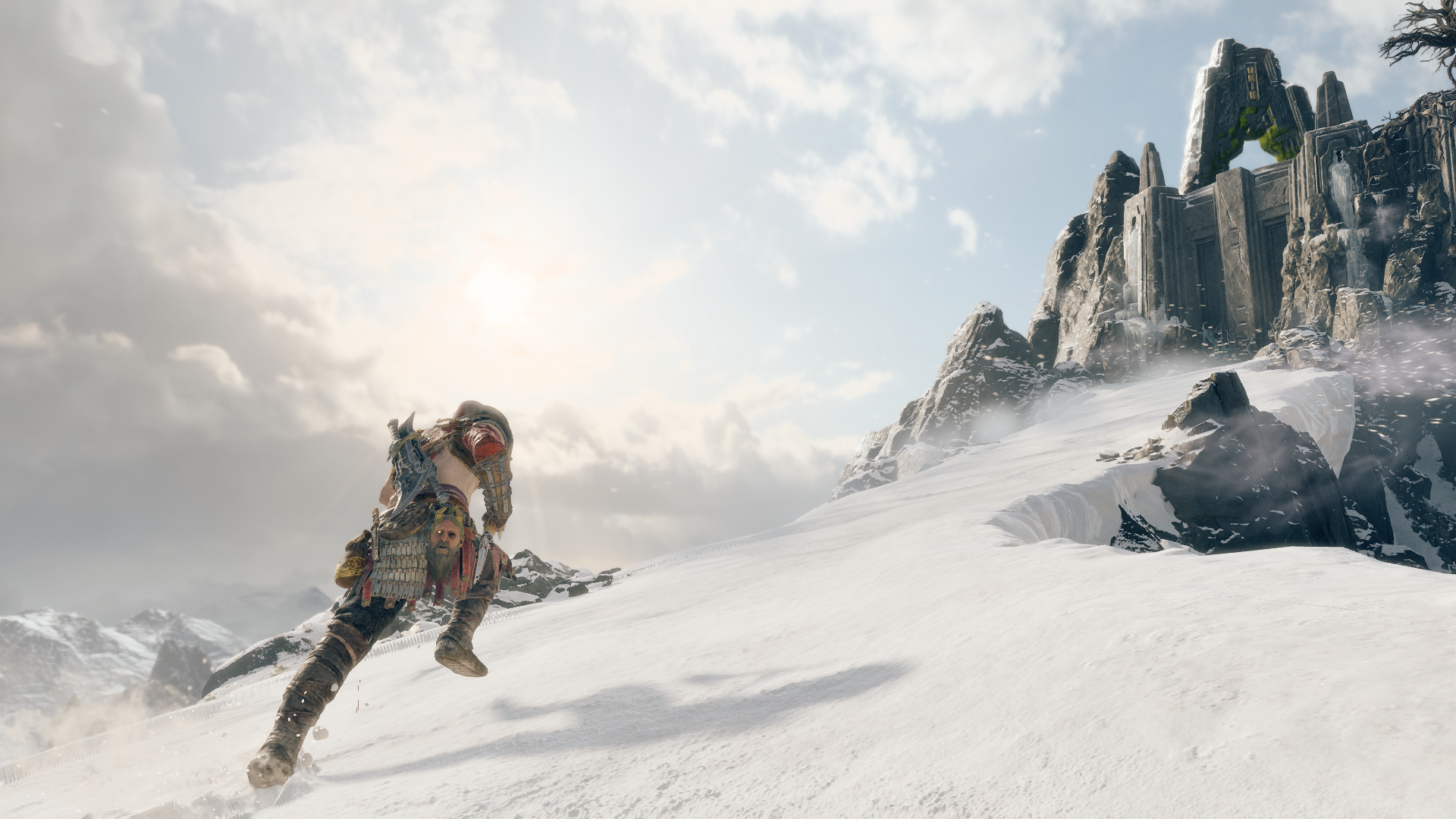 Kratos running up a snowy mountain in God of War HD Wallpaper