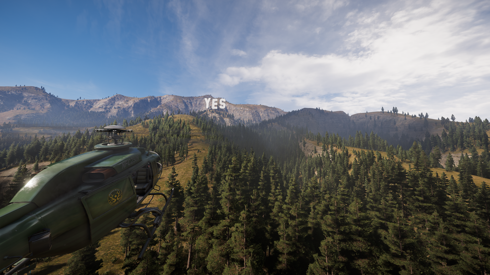 Helicopter flying towards YES sign on a mountain in Far Cry 5 HD Wallpaper