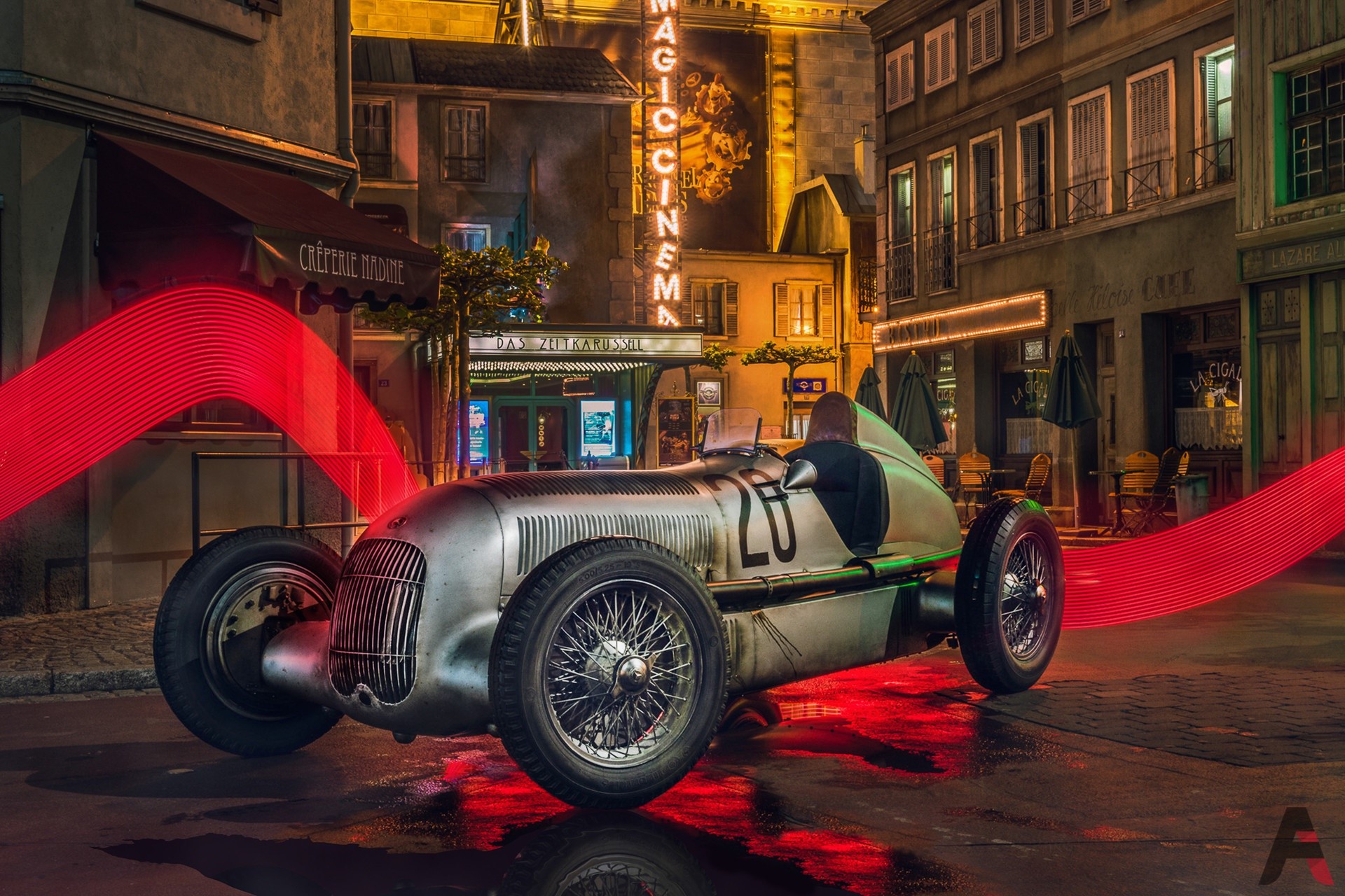 Vintage Mercedes-Benz Silver Arrows race car on a wet street HD Wallpaper