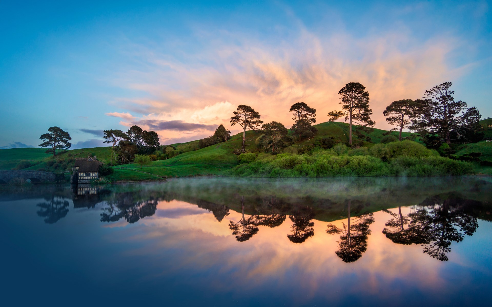Hobbiton landscape with lake and cottage at sunrise HD Wallpaper