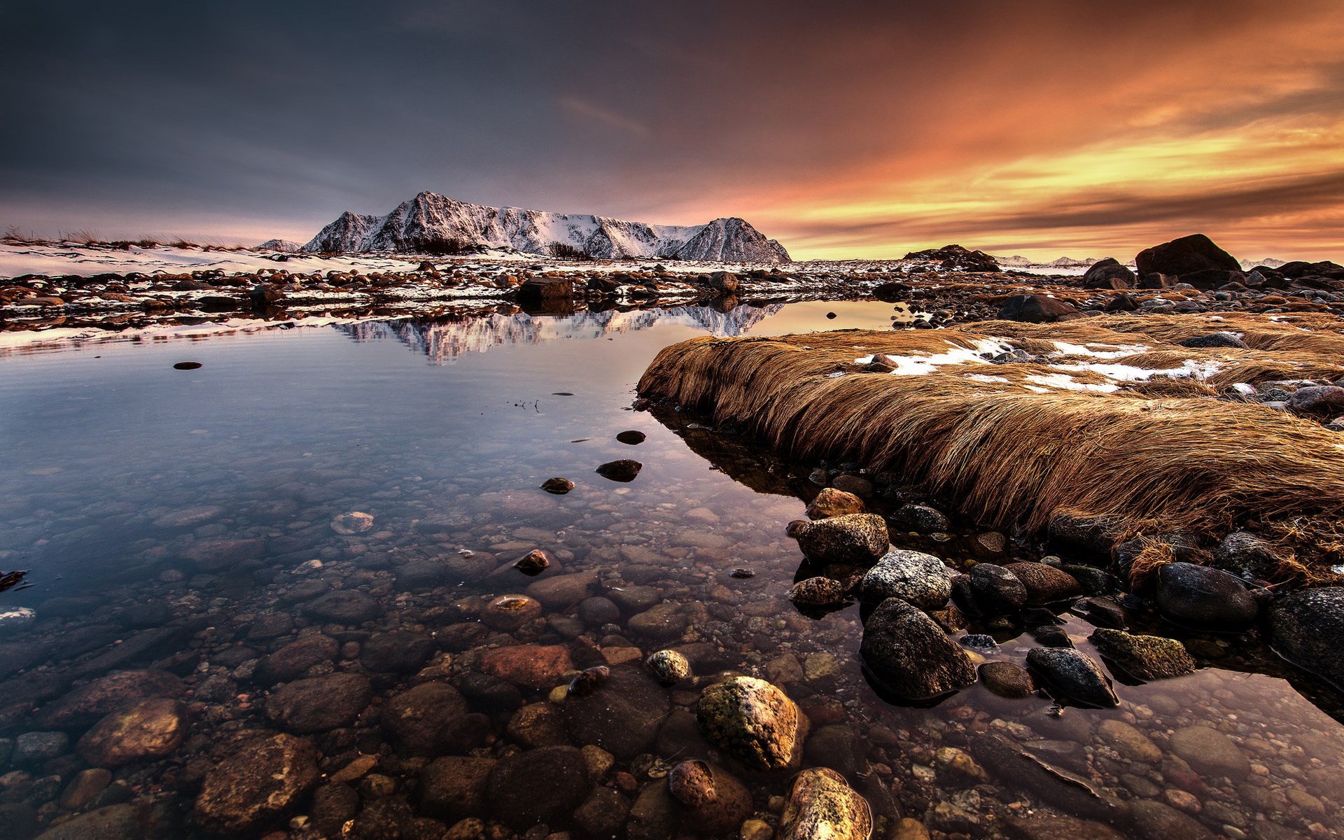 Snowy mountains reflected in water at sunset HD Wallpaper
