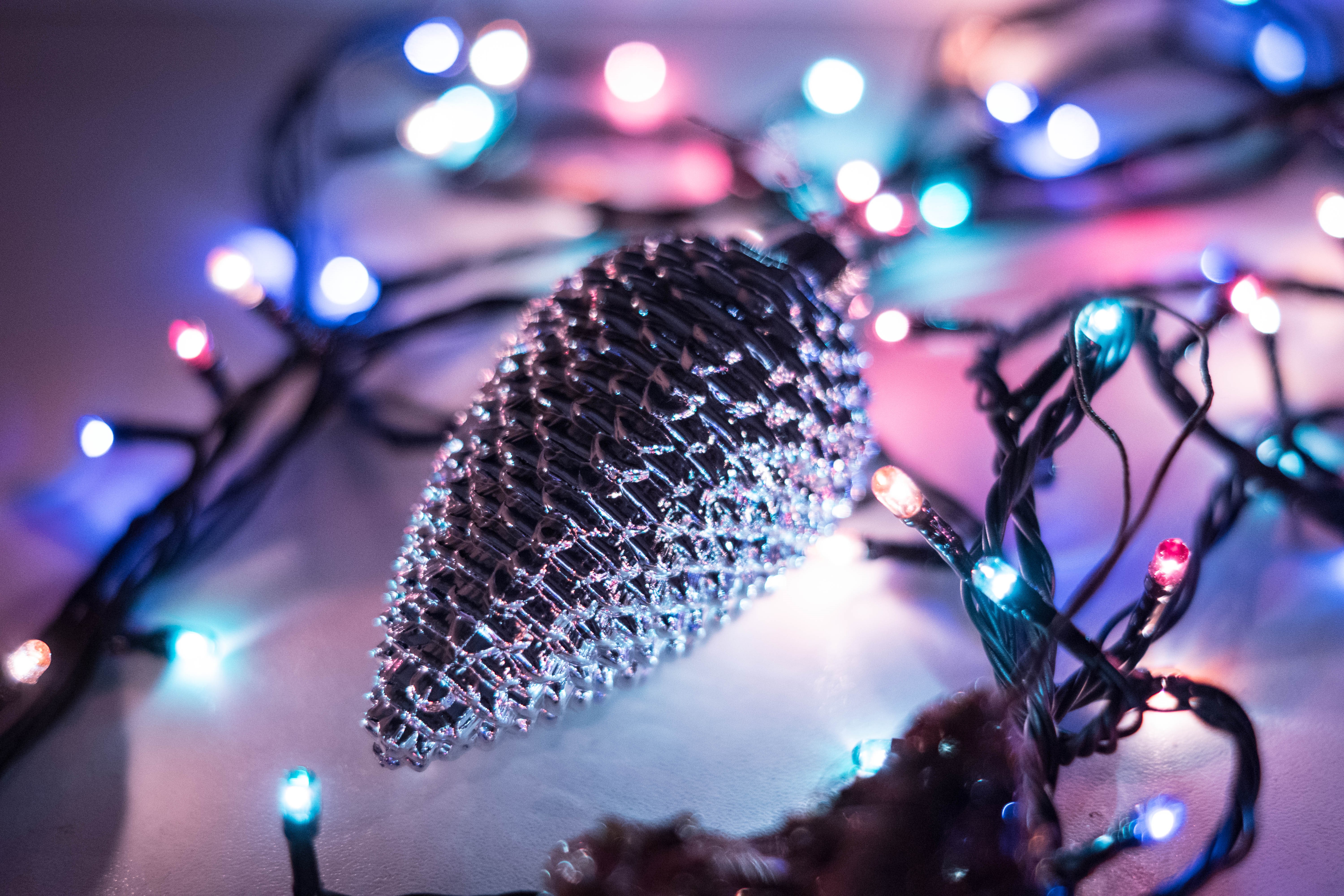 Christmas pinecone ornament with colorful bokeh lights HD Wallpaper