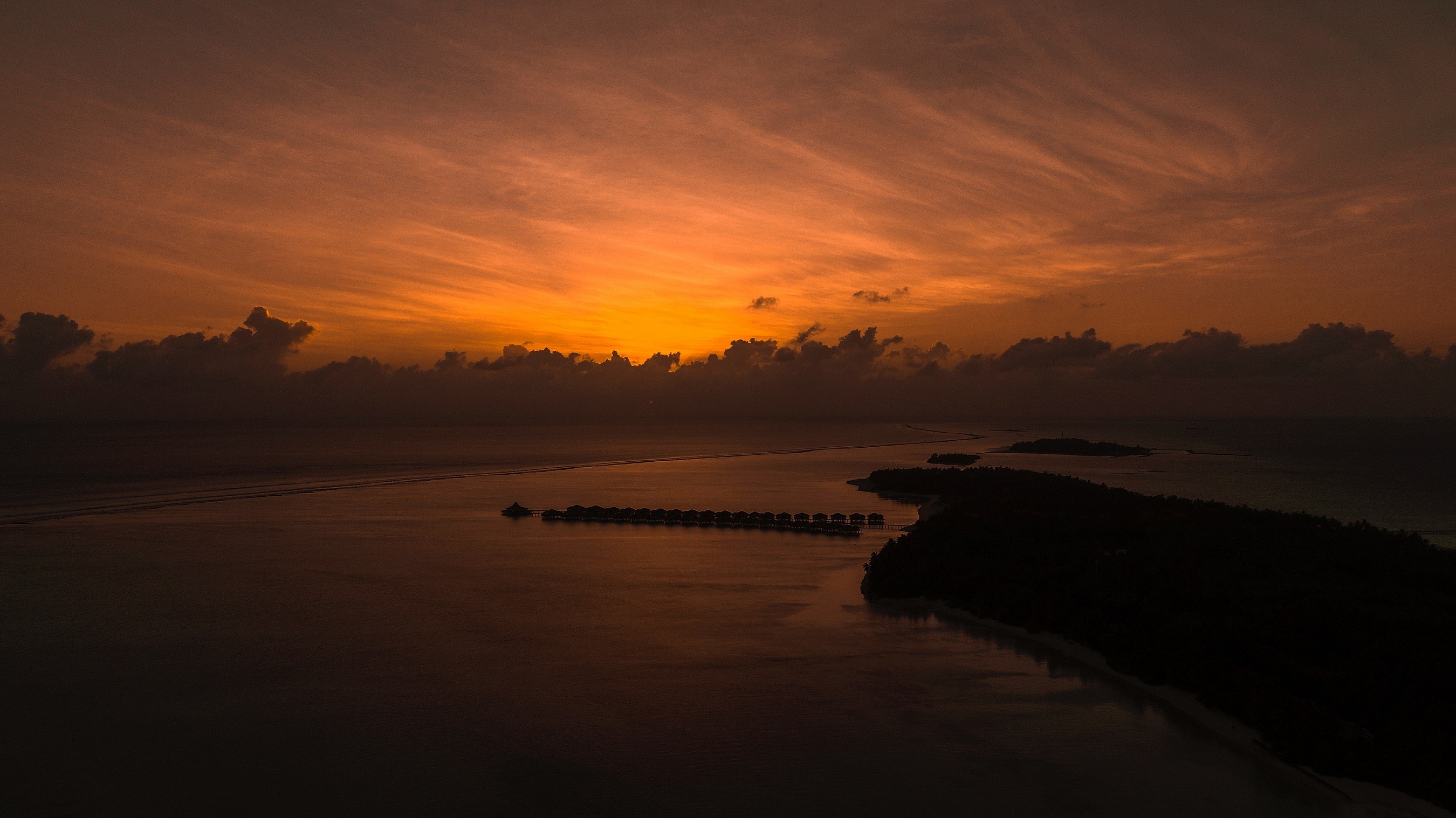 Island resort at sunrise over the ocean HD Wallpaper