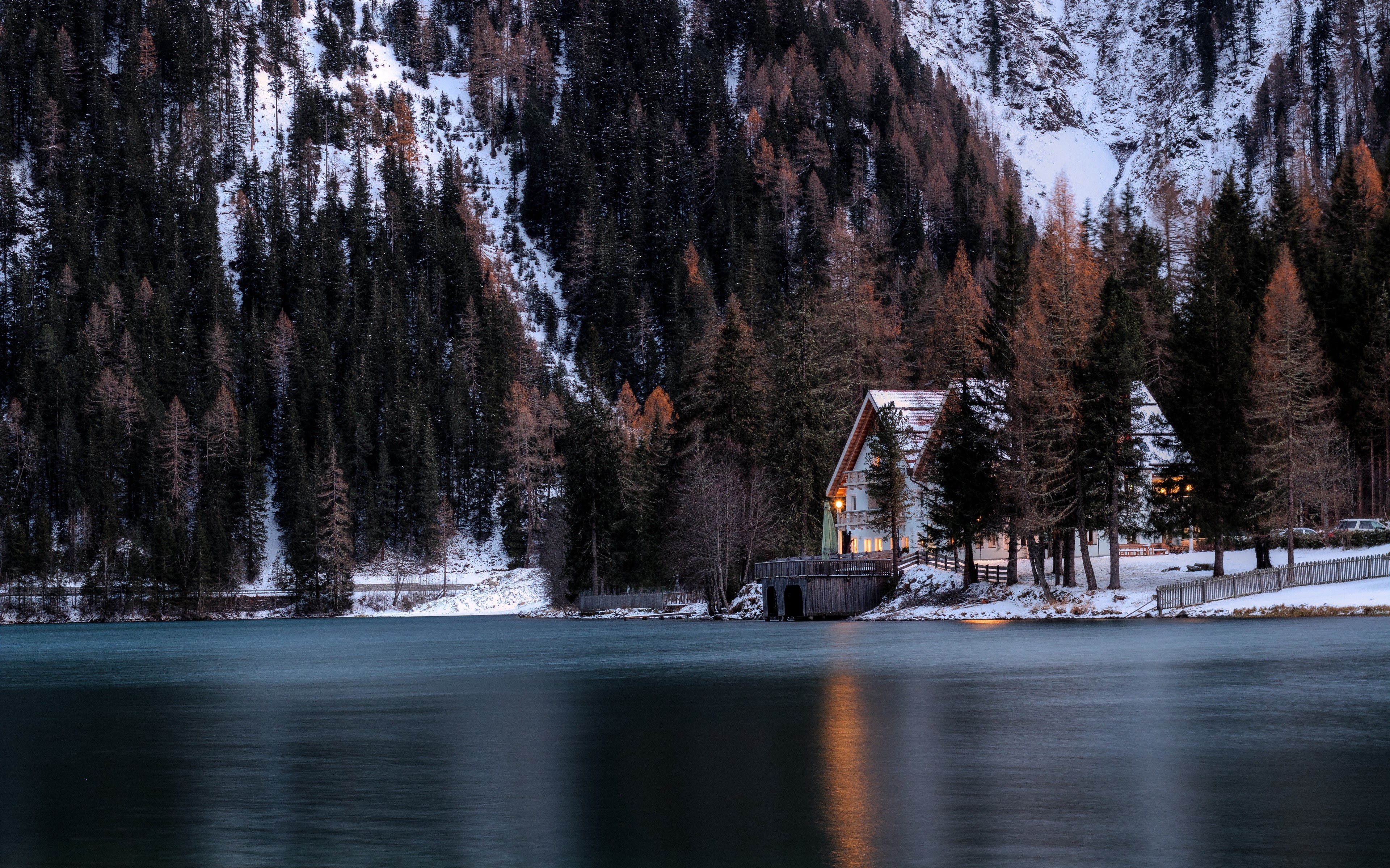 Snowy mountain lake with houses and forest HD Wallpaper