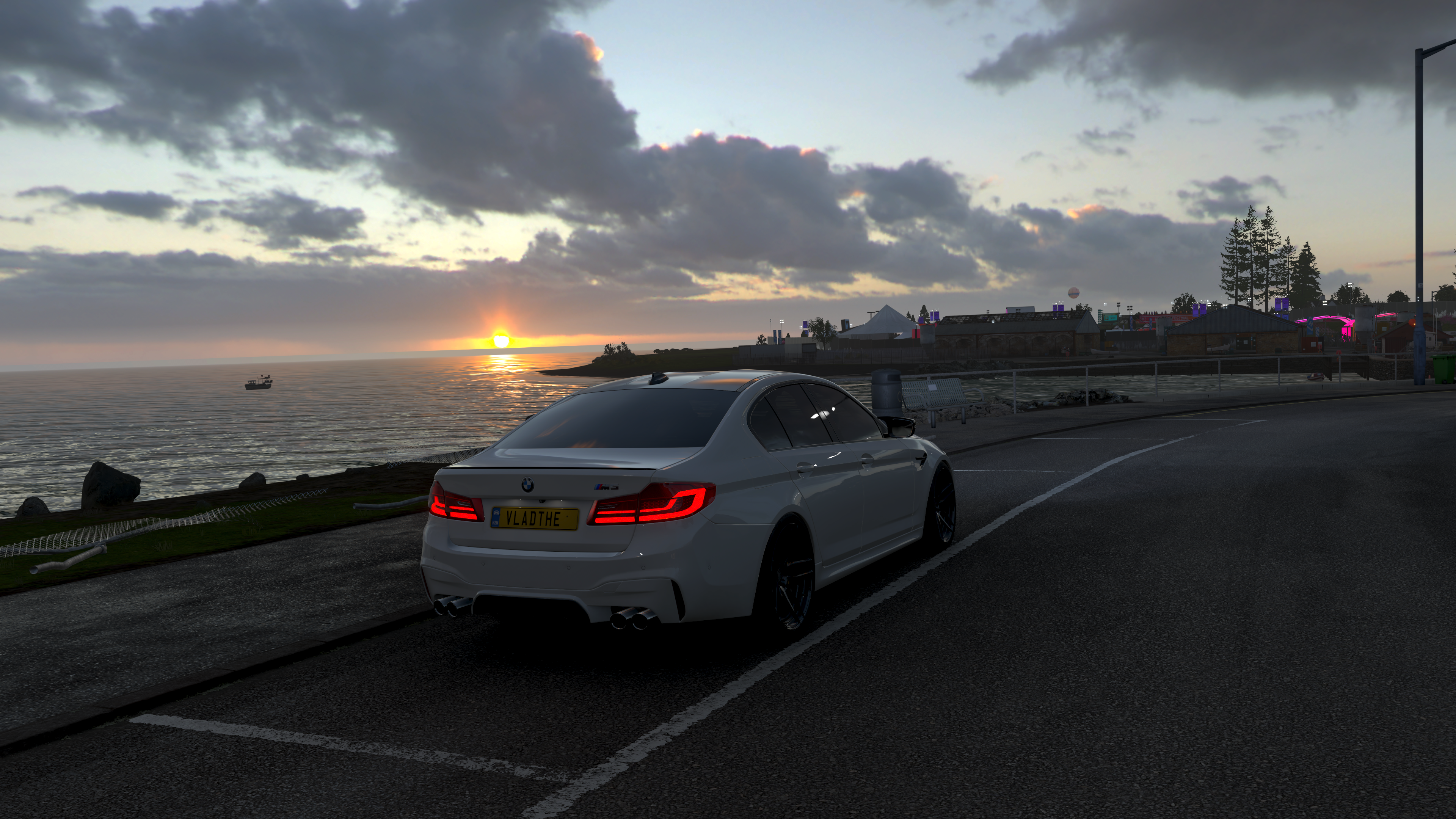 White BMW F90 M5 on a road at sunset in Forza Horizon 4 HD Wallpaper