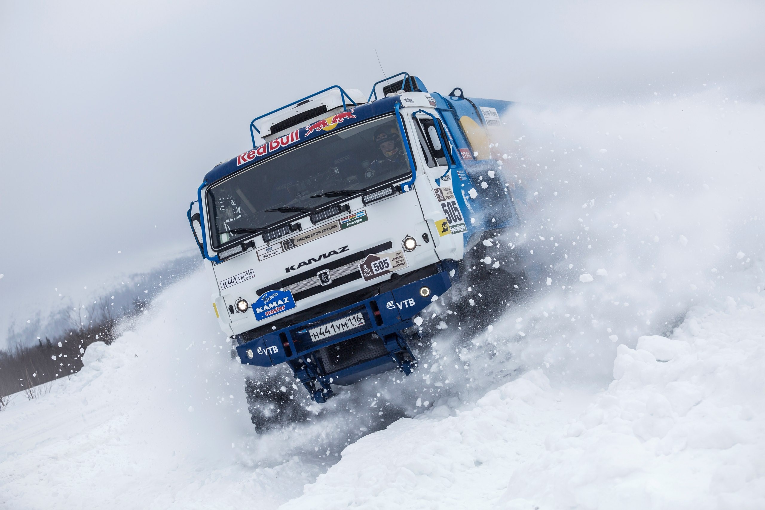 Kamaz truck racing through snow HD Wallpaper