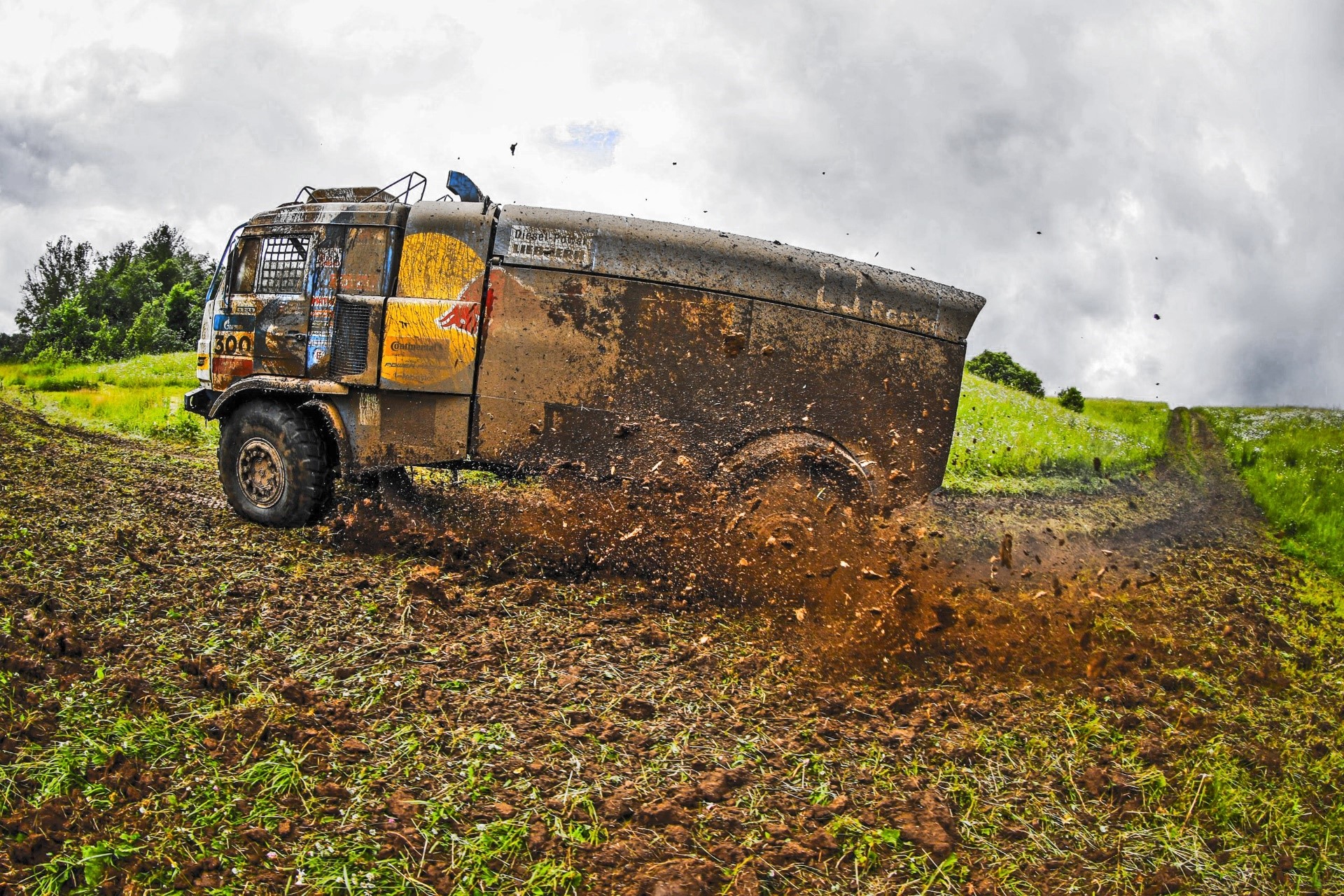 Kamaz truck racing through mud HD Wallpaper