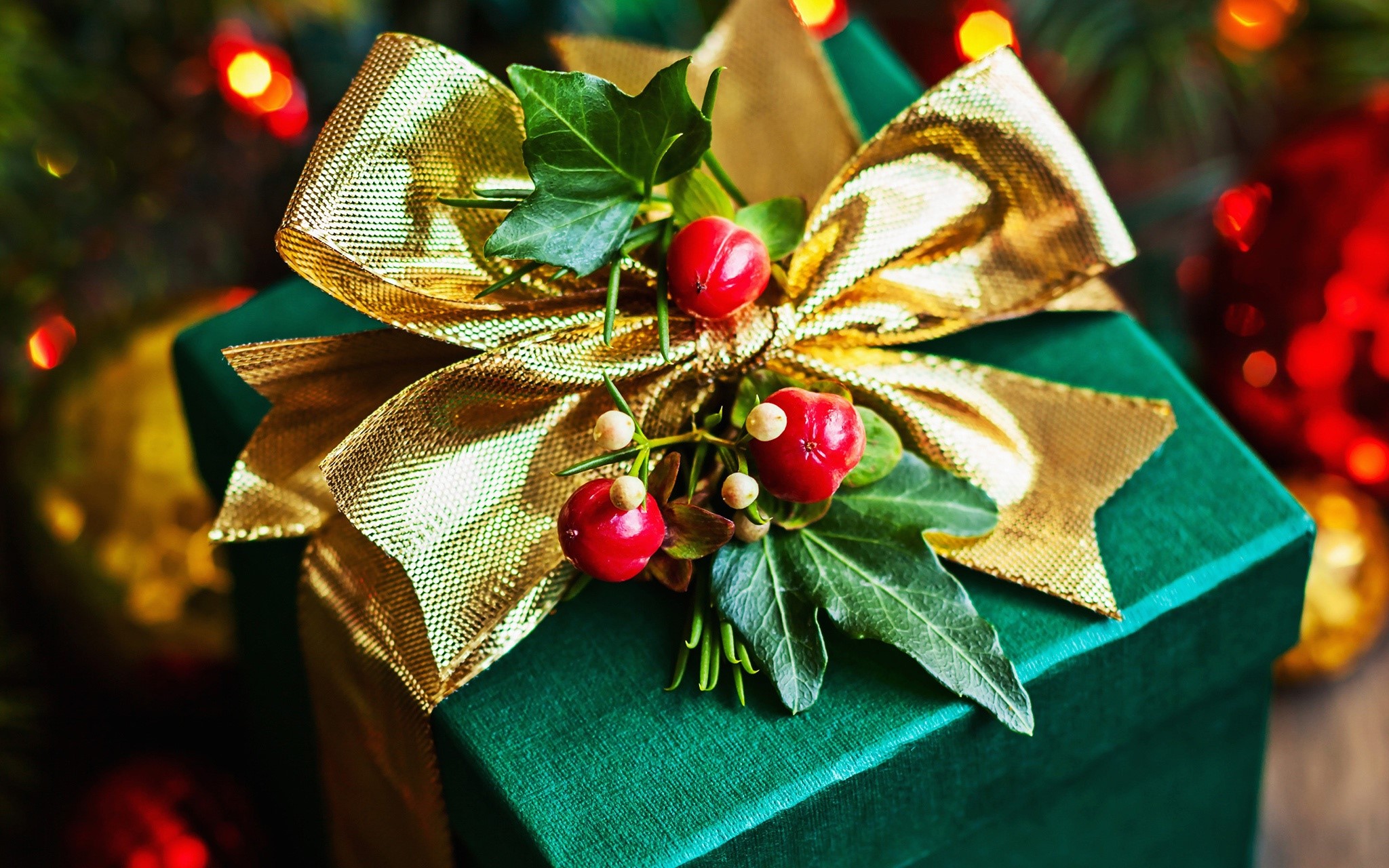 Green Christmas Gift Box with Gold Bow and Berries HD Wallpaper