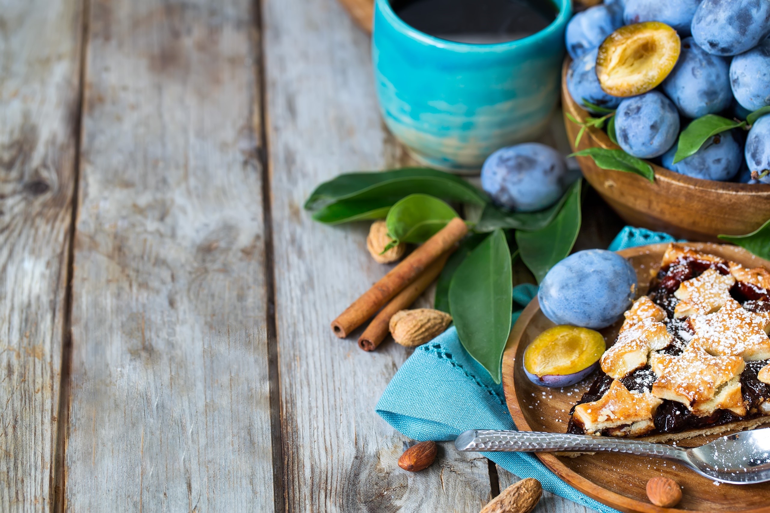 Plum cake with coffee and plums on a wooden table HD Wallpaper