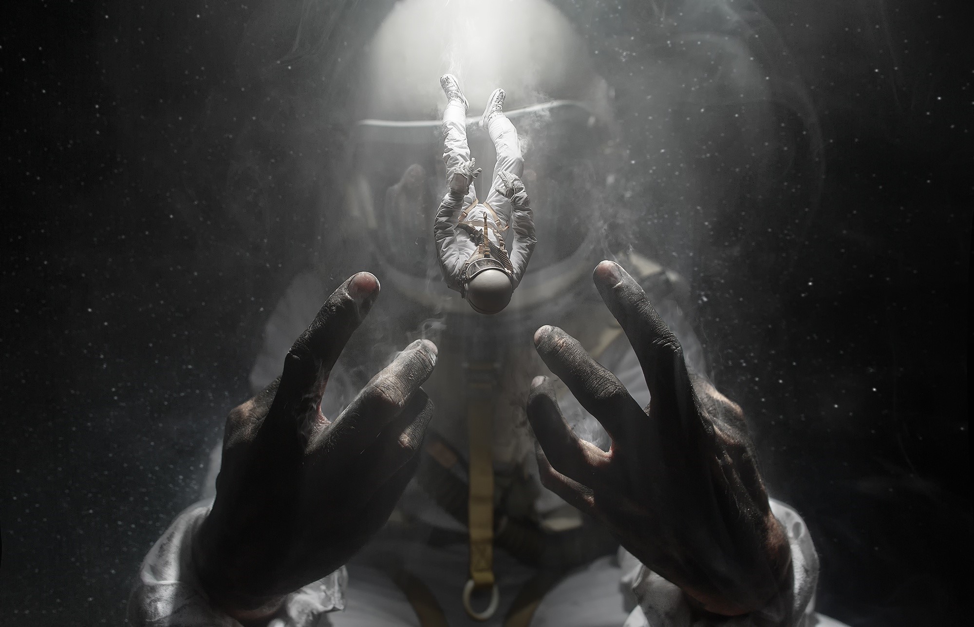 Astronaut floating in space with hands reaching out HD Wallpaper