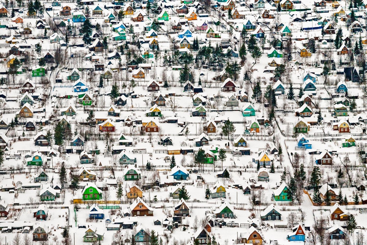 Aerial view of a snow-covered village in Russia HD Wallpaper
