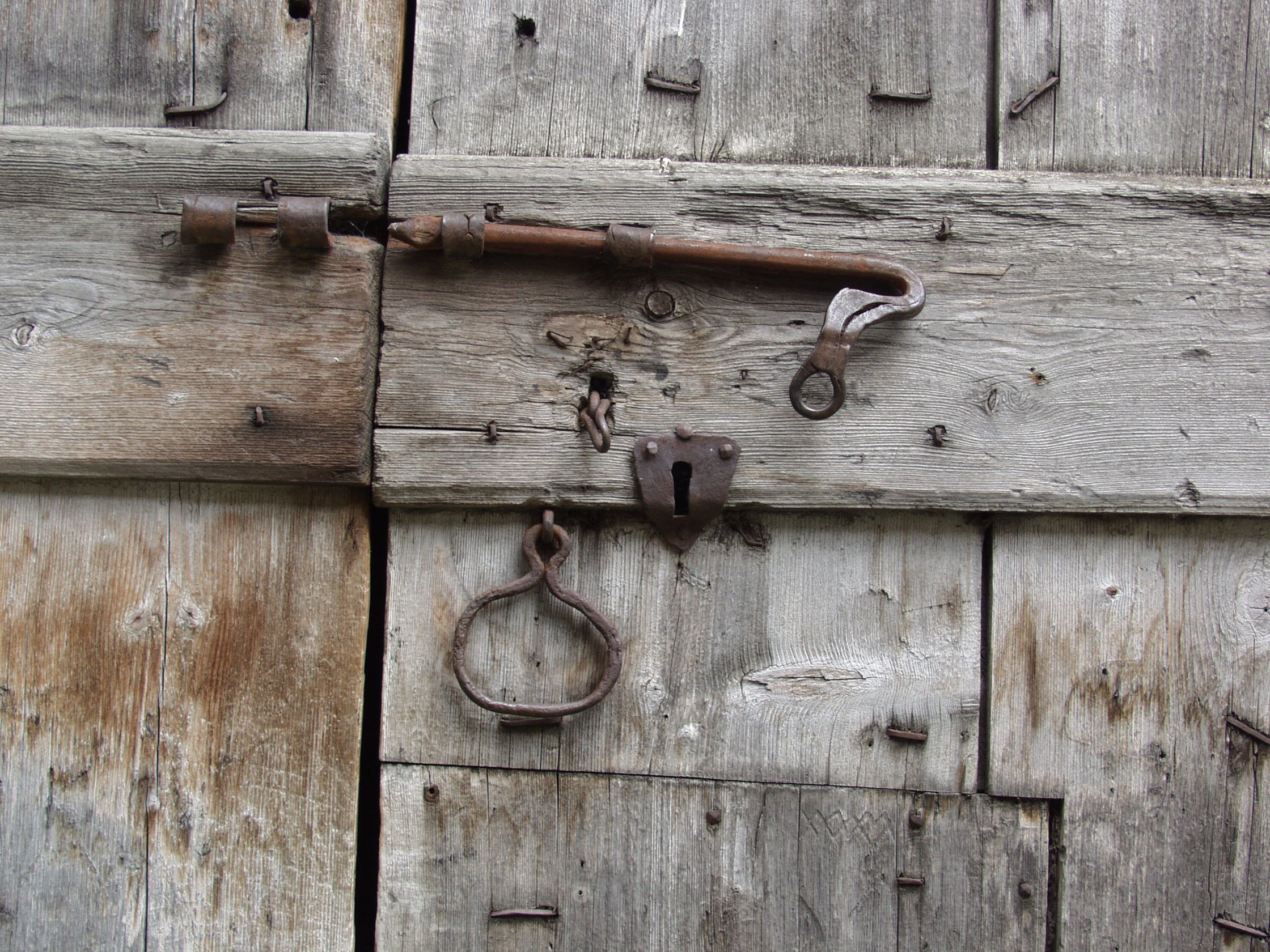 Old wooden door with rusty hardware HD Wallpaper