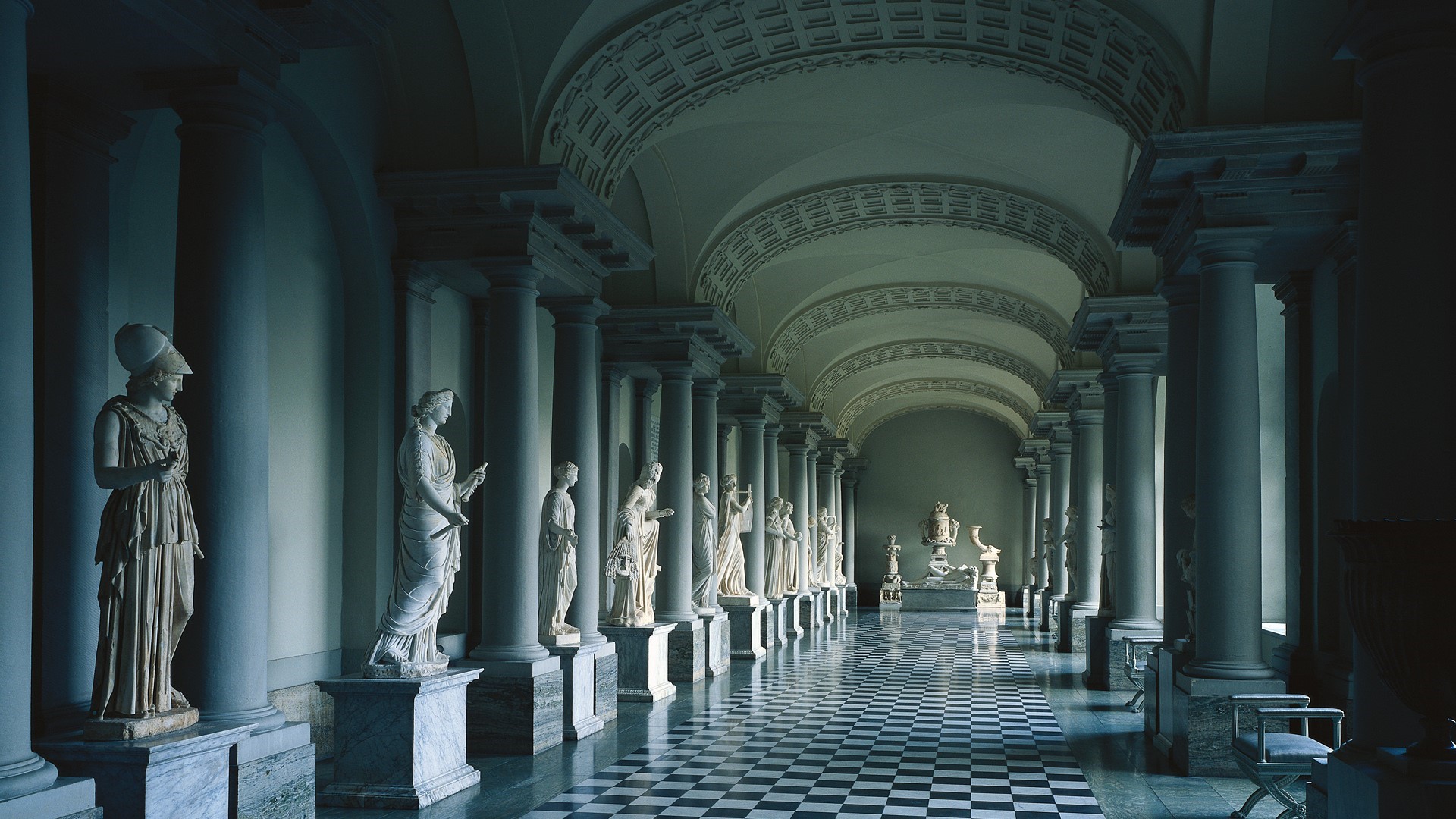 Hallway with classical sculptures and columns HD Wallpaper