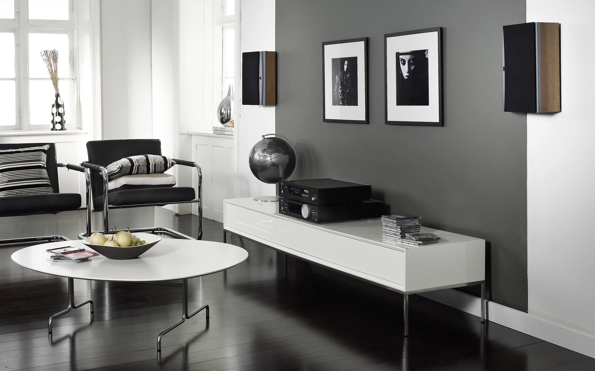 Living room with chairs, stereo, and speakers HD Wallpaper