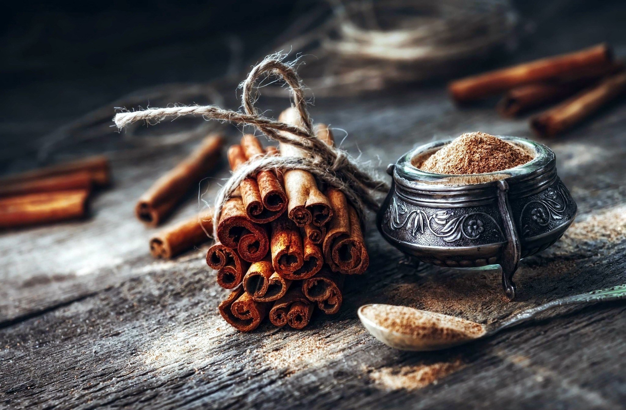Rustic cinnamon sticks and powder still life HD Wallpaper