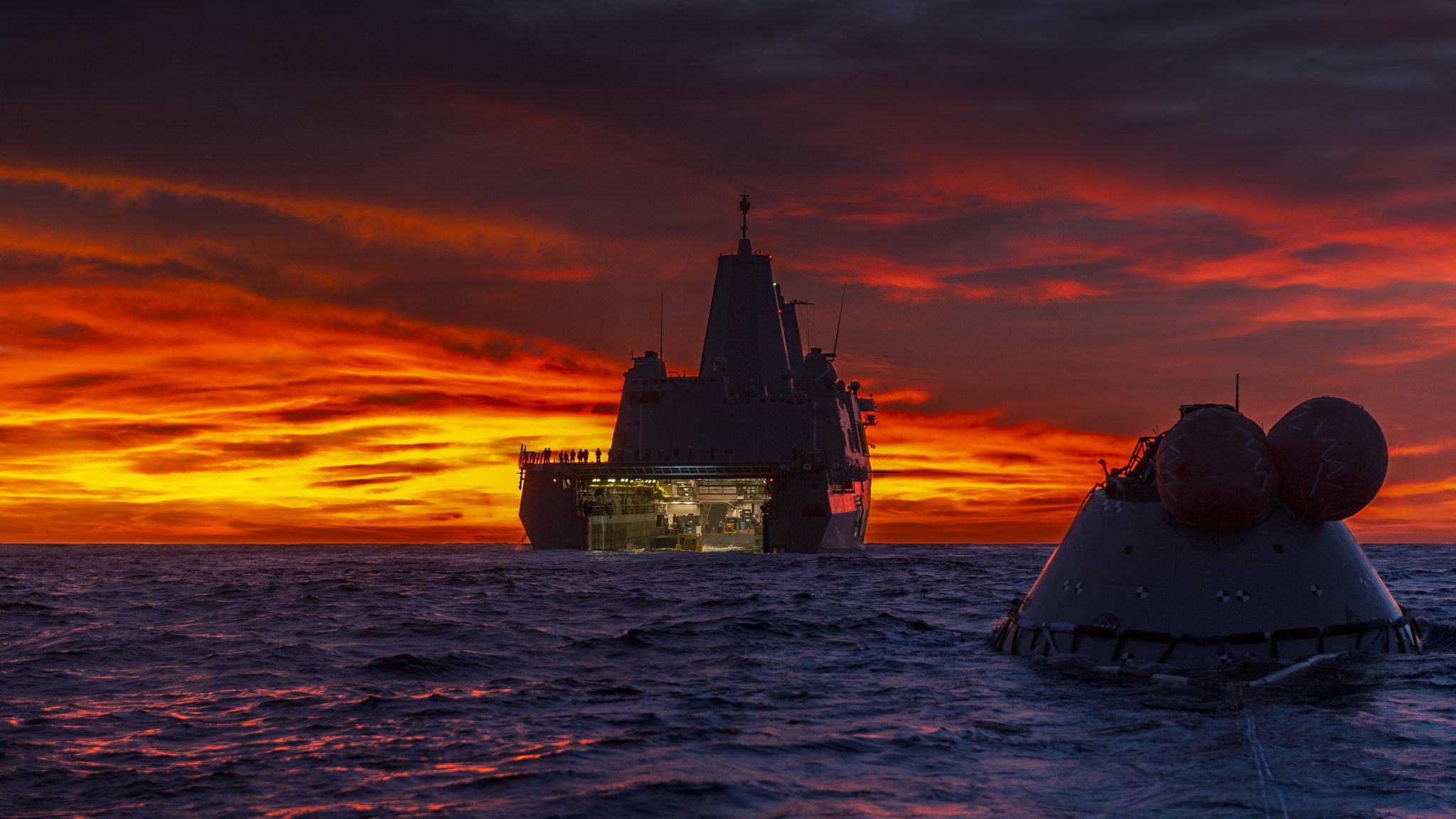 Space capsule and ship at sunset on the ocean HD Wallpaper