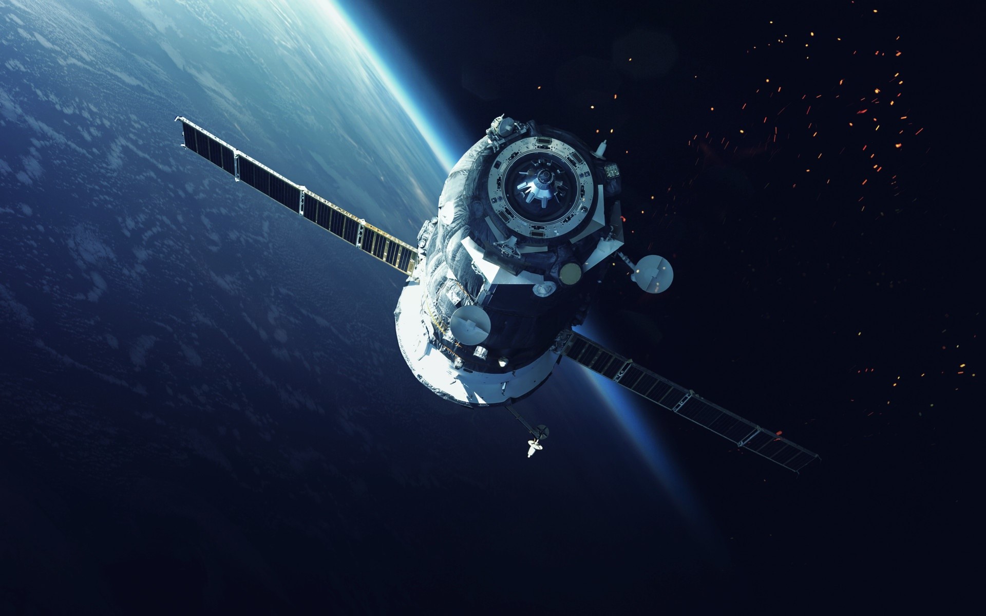 Spacecraft orbiting Earth with debris HD Wallpaper