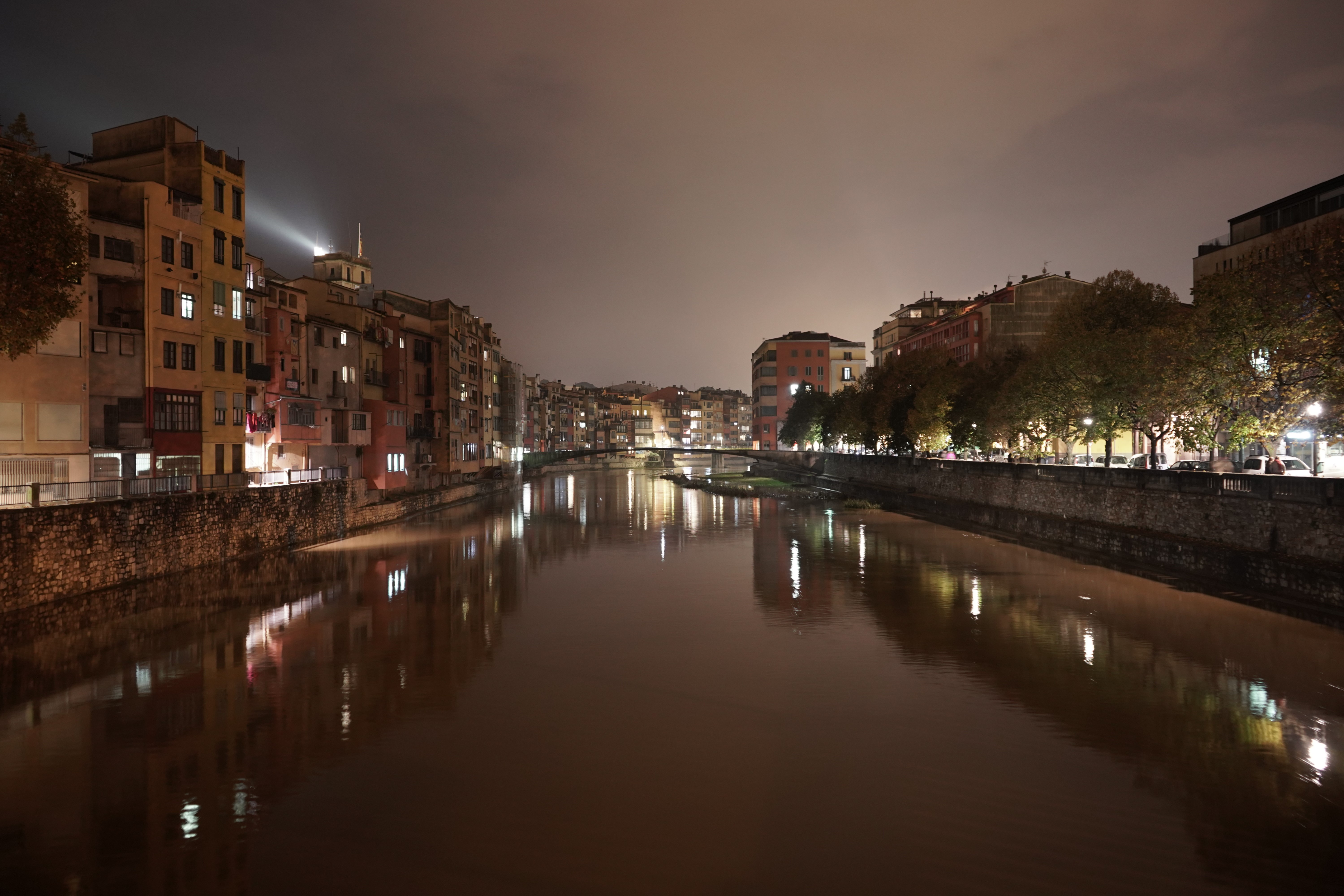 Cityscape at night with river and buildings in Girona, Spain HD Wallpaper