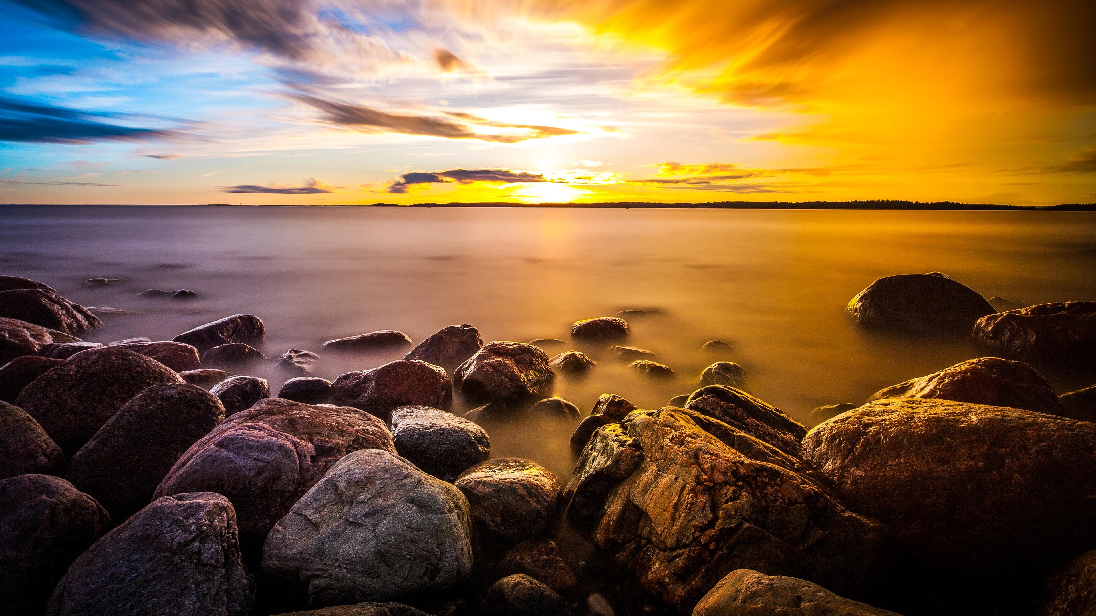 4K stones on a rocky shore at sunset HD Wallpaper