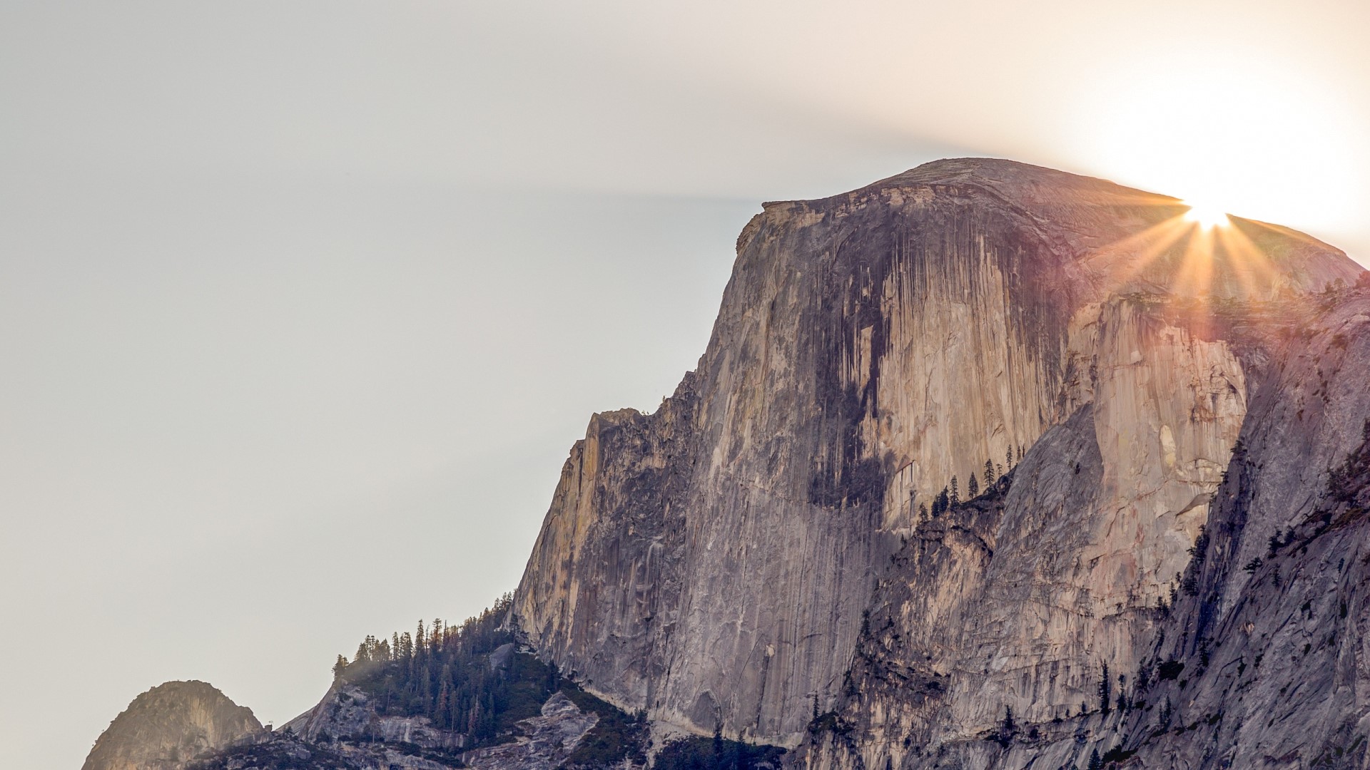 Sun rays over Half Dome in Yosemite National Park HD Wallpaper