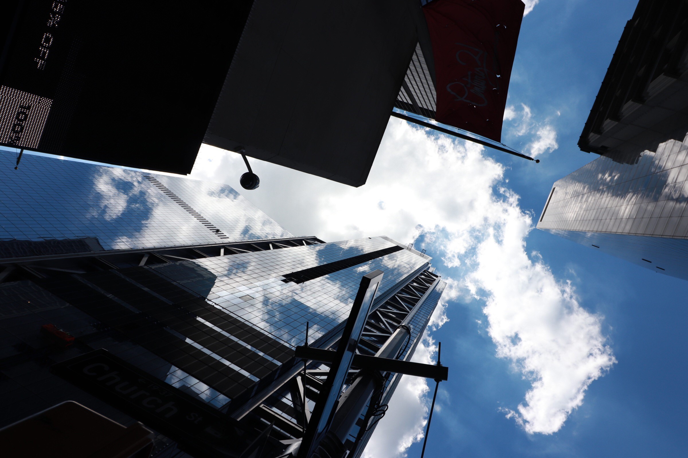 Looking up at skyscrapers and clouds in New York City HD Wallpaper