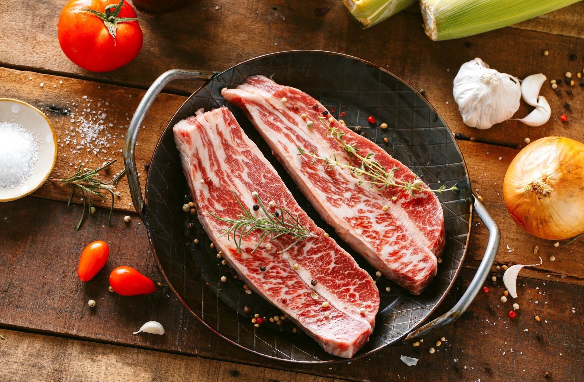 Raw beef steaks with herbs and vegetables HD Wallpaper