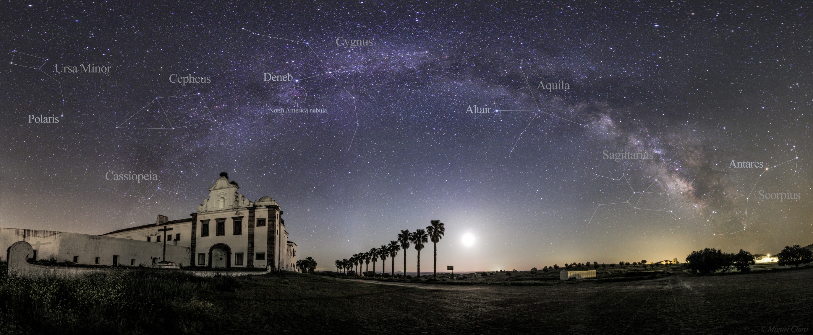 Panorama of the Milky Way over a building and palm trees HD Wallpaper