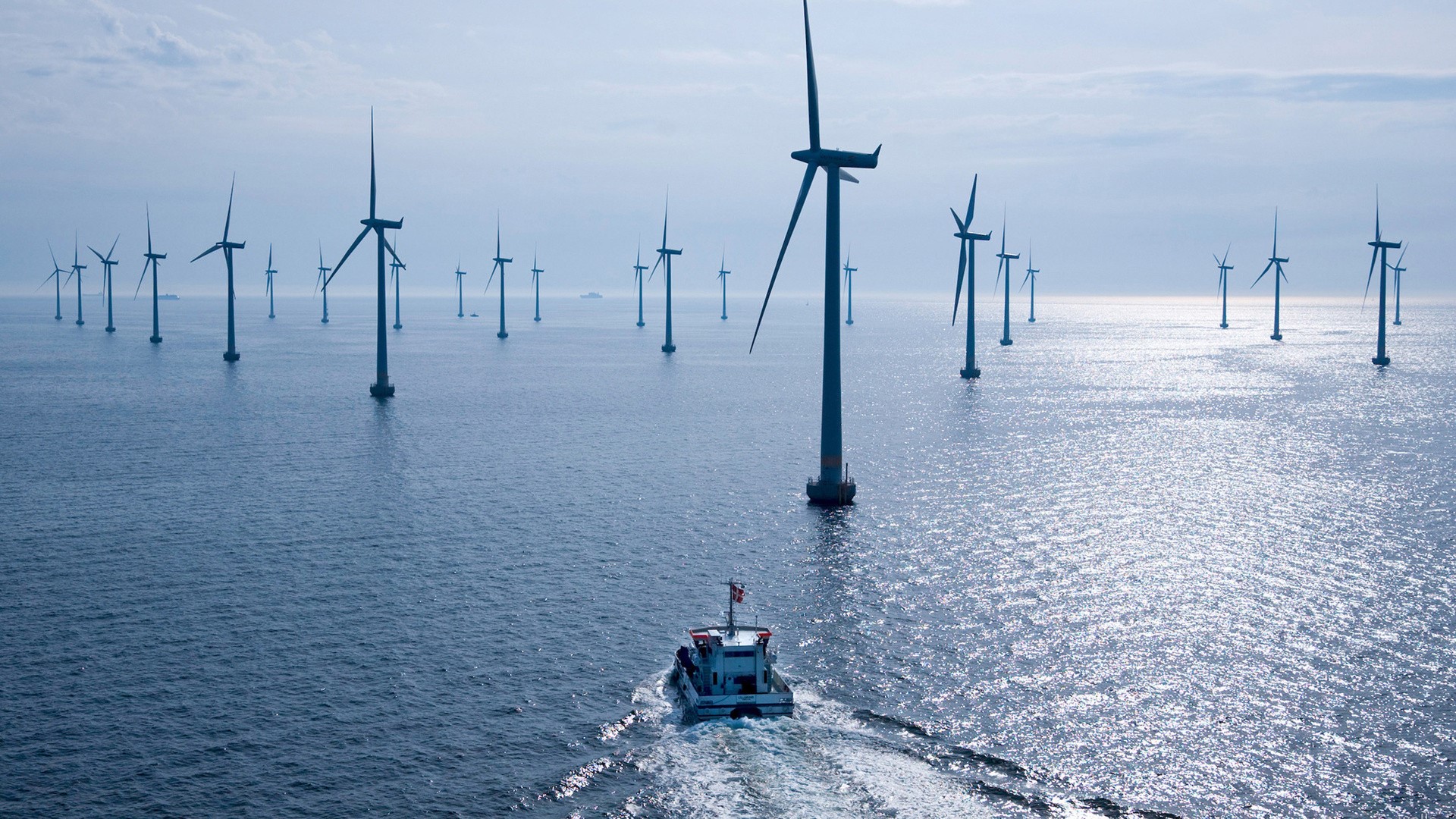 Offshore wind farm with a boat HD Wallpaper