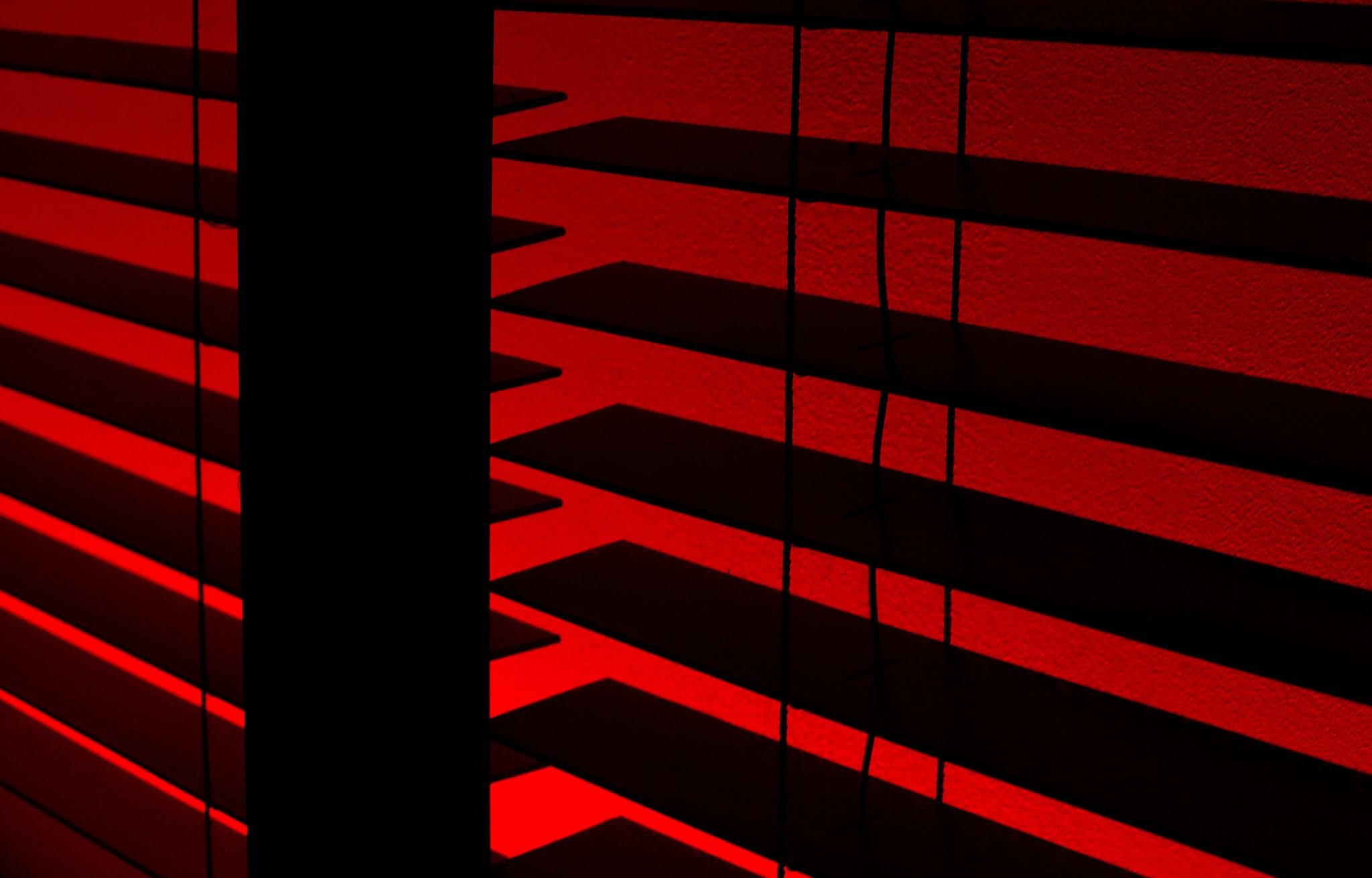 Red blinds with dark shadows and light patterns HD Wallpaper
