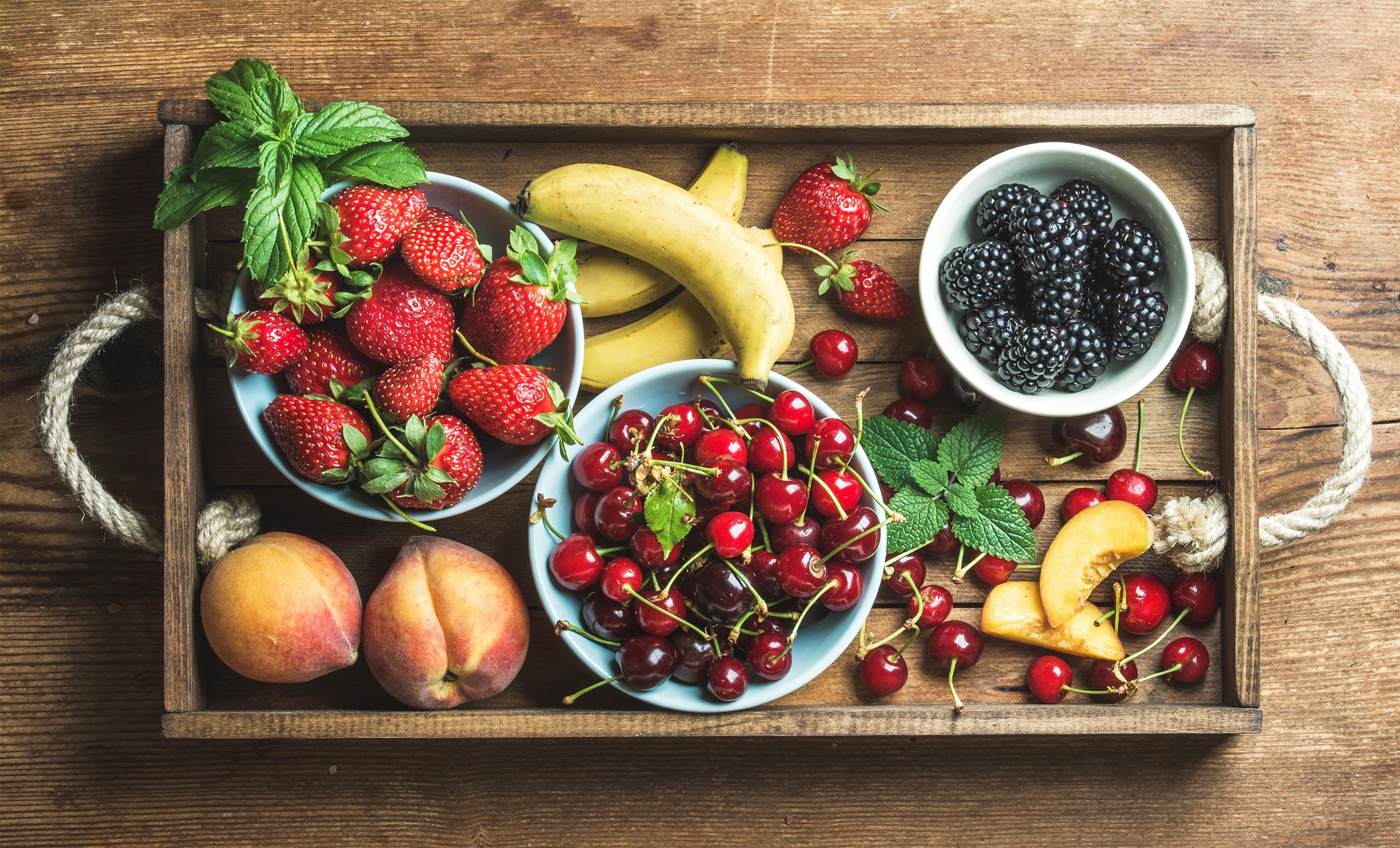 Tray of fresh fruits including strawberries, blackberries, cherries, bananas, and peaches HD Wallpaper