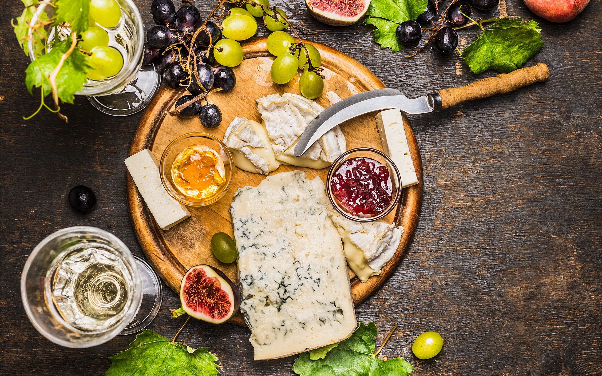 Cheese board with grapes, figs, jam, and wine HD Wallpaper