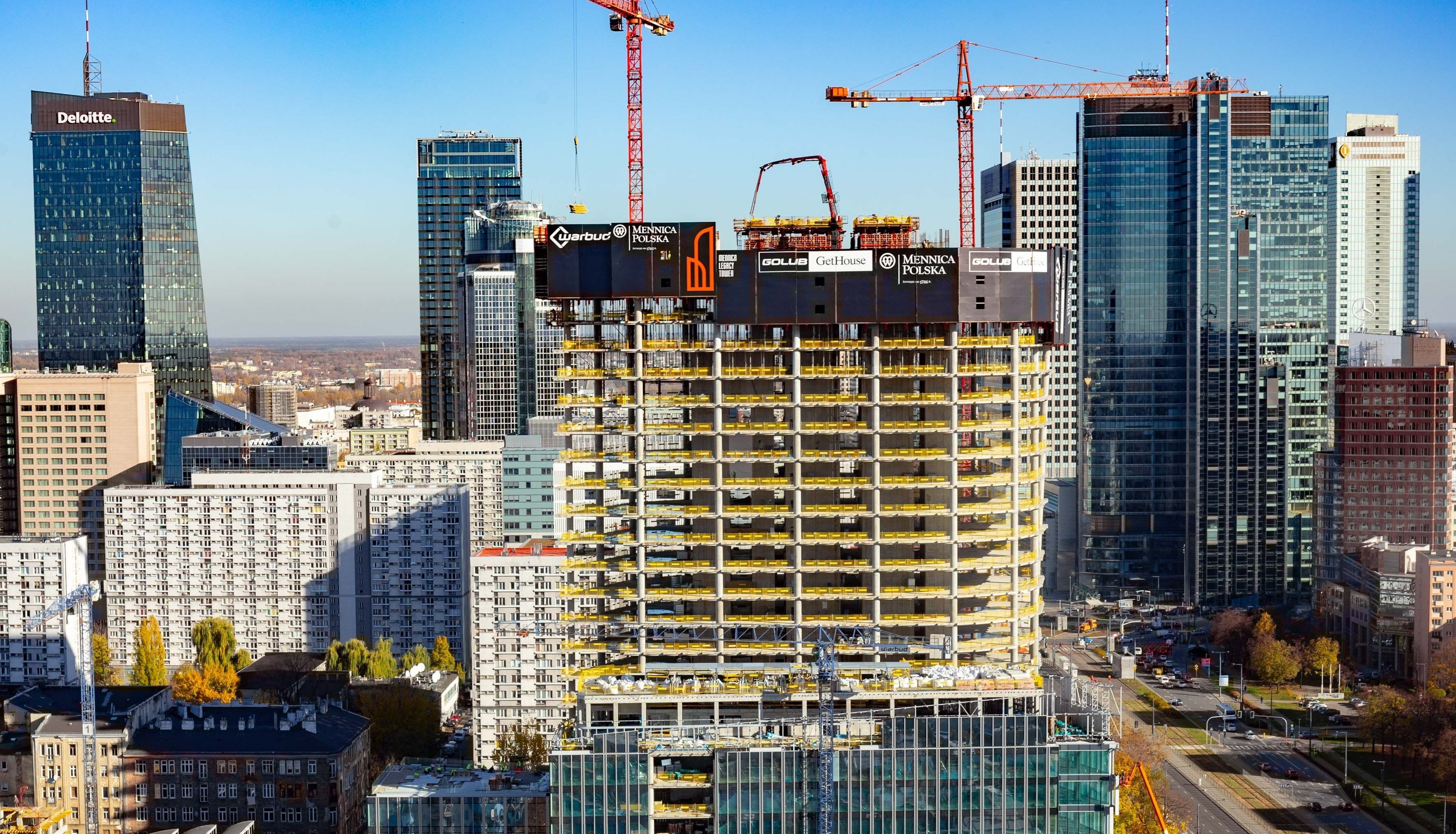 Warsaw cityscape with skyscrapers and construction site HD Wallpaper