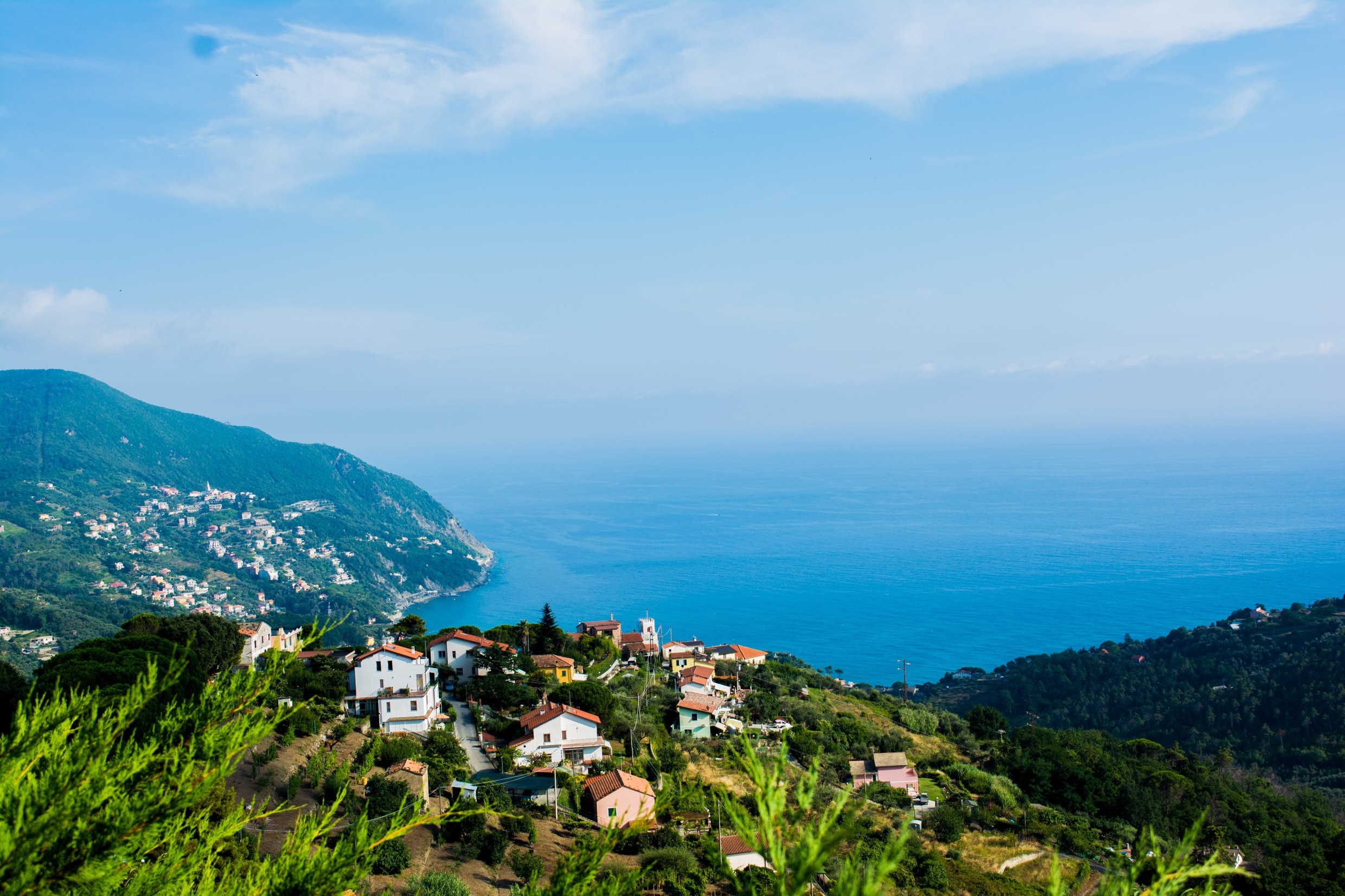 Coastal village on a hillside overlooking the sea in Italy HD Wallpaper