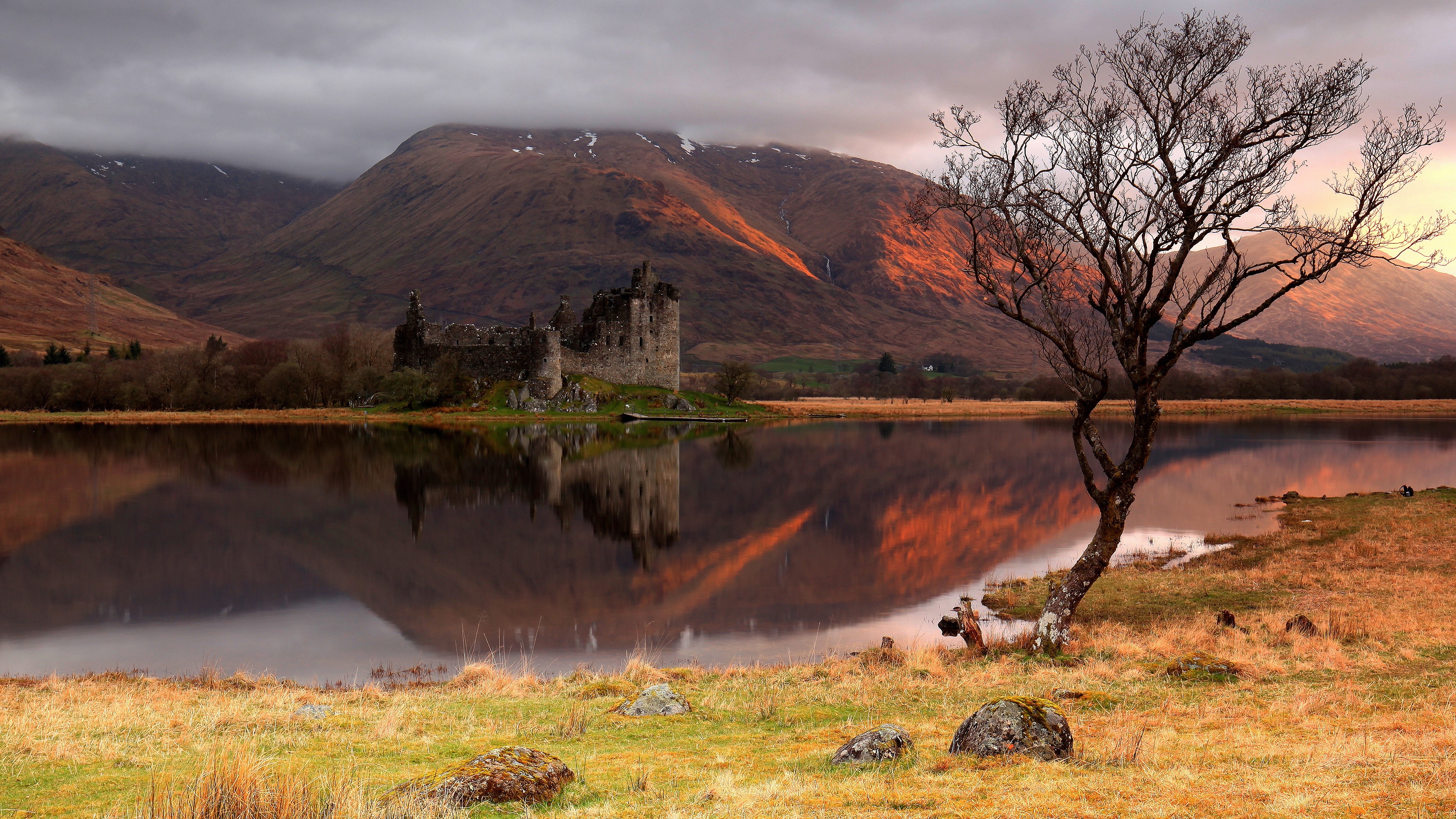 Castle ruin reflection on water with mountains and tree HD Wallpaper